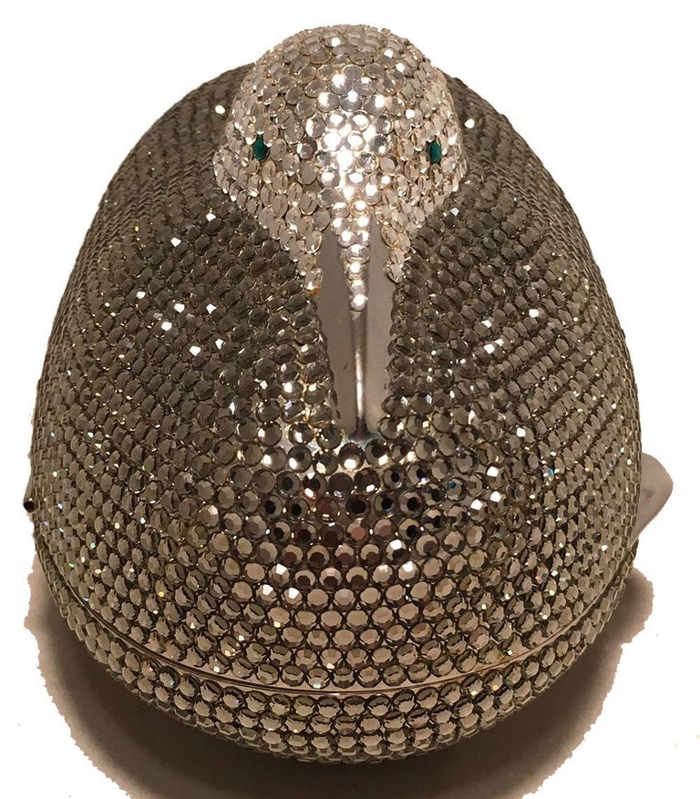 GORGEOUS JUDITH LEIBER swarovski crystal sitting duck minaudiere in excellent vintage condition. Gray and silver swarovski crystal exterior trimmed with silver hardware. Lifting style closure opens to a silver leather lined interior that holds 1