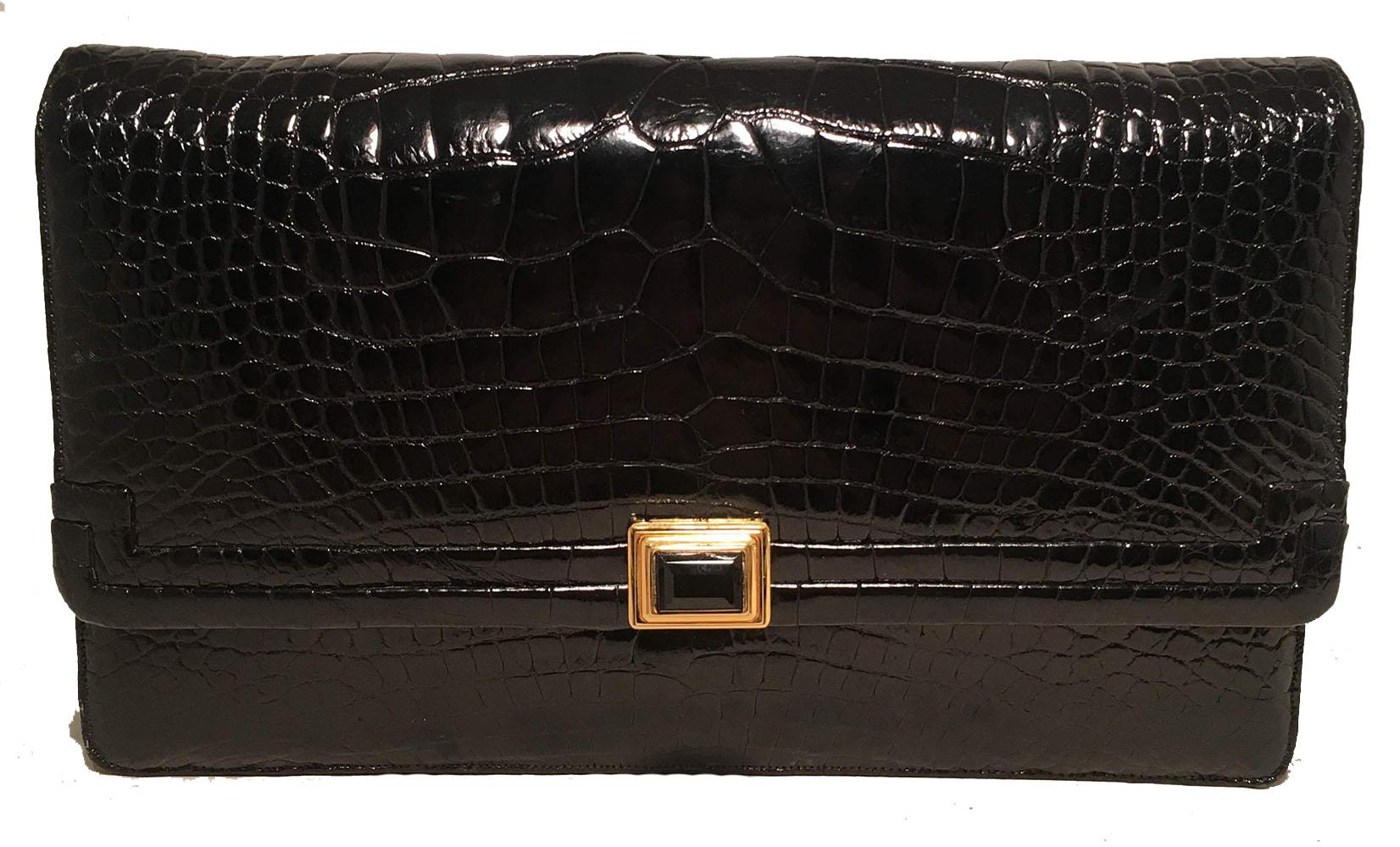 STUNNING Judith Leiber Vintage Black Alligator Shoulder Bag Clutch in excellent condition. Black alligator leather exterior trimmed with a front black and gold sliding latch closure and backside slit pocket. Matching alligator and leather shoulder