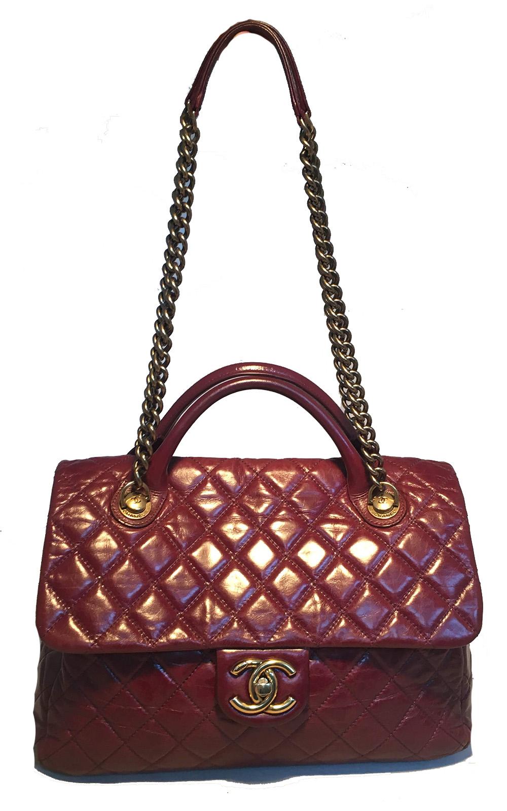 TIMELESS Chanel Maroon Distressed Quilted Leather Large Classic Flap Shoulder Bag in excellent condition. Quilted maroon distressed calfskin leather exterior trimmed with antiqued bronze hardware. Top double handles and 2 chain and leather shoulder