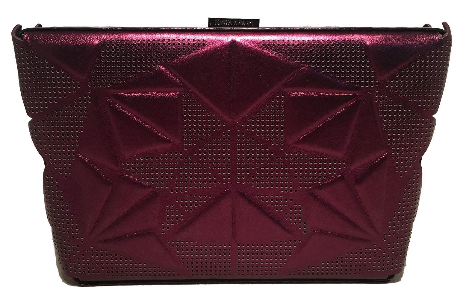 GORGEOUS Tonya Hawkes Purple Metallic Embossed and Laser Cut Leather Clutch in excellent condition. Dark purple leather exterior with a unique geometric embossed pattern and laser cut tiny holes throughout. Striped black and purple outer sides. Top