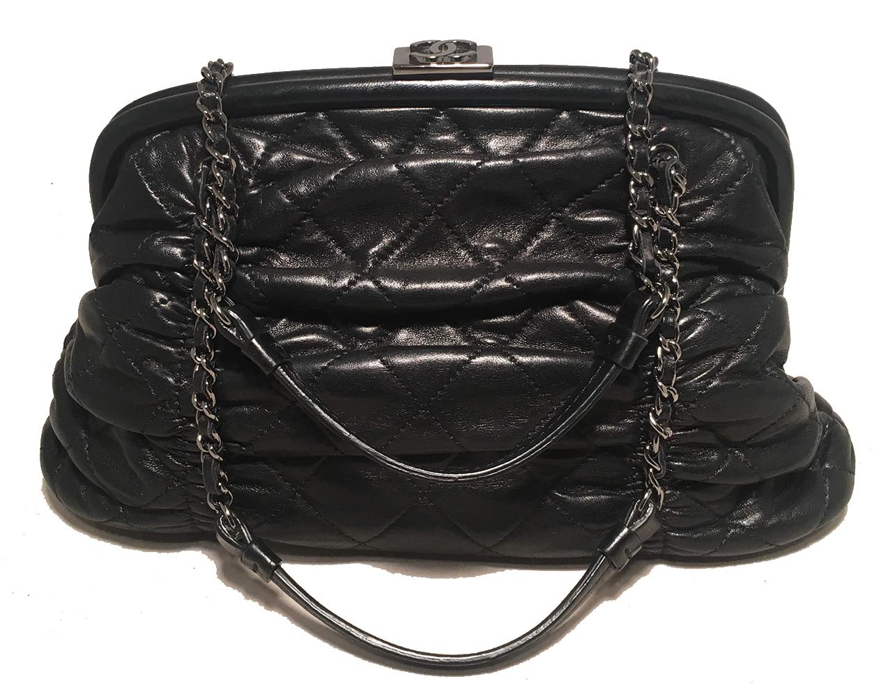 TIMELESS Chanel Black Quilted Leather Ruched Frame Handbag in excellent condition. Black quilted and ruched leather exterior trimmed with woven chain and leather double handles and silver hardware. Top lift closure opens to a grey silk lined
