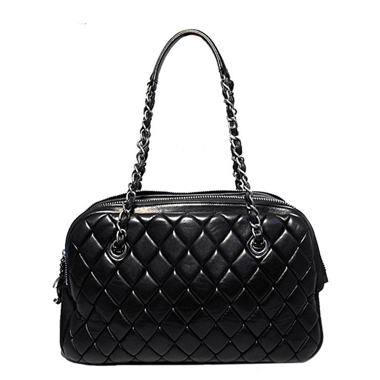 RARE CHANEL SHOPPER in black quilted calfskin in excellent condition.  Soft, black, quilted calfskin leather exterior trimmed with a double zippered top closure and gunmetal hardware.  Black nylon interior holds 1 side zippered pocket, 1 cell phone