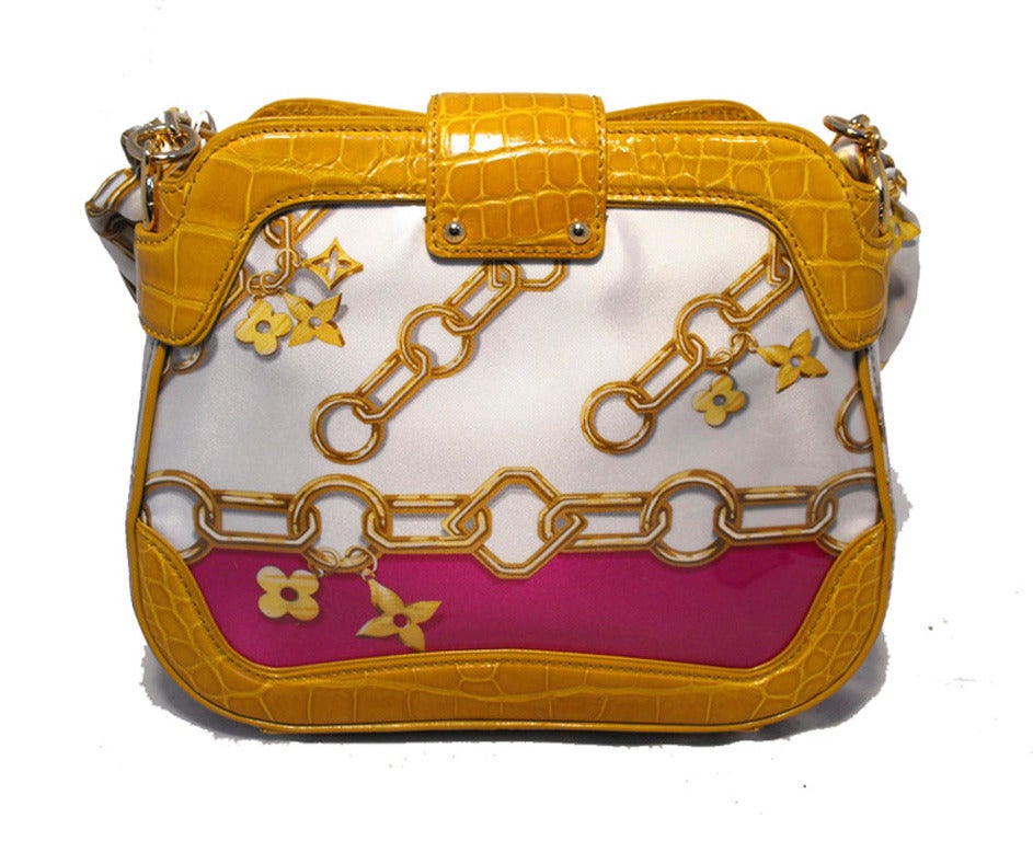 LOUIS VUITTON limited edition Gianni monogram charms bag in very good condition.  Tan alligator trim, vinyl covered silk scarf with the signature monogram charms design in white and fuschia and gold. Removable scarf shoulder strap.  Chain link