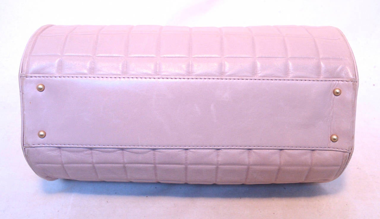 GORGEOUS AUTHENTIC Chanel Lilac Square Quilted Leather Cylinder Tube Shoulder Bag in excellent condition.  Beautiful square quilted lilac lambskin leather exterior trimmed with matte gold hardware.  Top zipper closure opens to a tan nylon lined