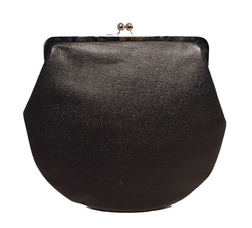 Fabulous Brooks Brothers black caviar oversized clutch in excellent NWT condition.  Black caviar leather exterior trimmed with silver hardware.  Top kiss lock closure opens to a striped beige and blue canvas lined interior that holds a long hidden