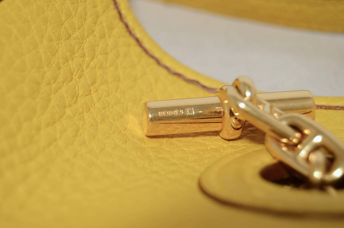 Adorable Hermes mini tpm vespa bag in excellent condition.  Yellow clemence leather trimmed with gold hardware.  Top toggle closure opens to an unlined suede interior. Excellent condition.  No stains, smells, or scuffs.  Clean corners, edges, and