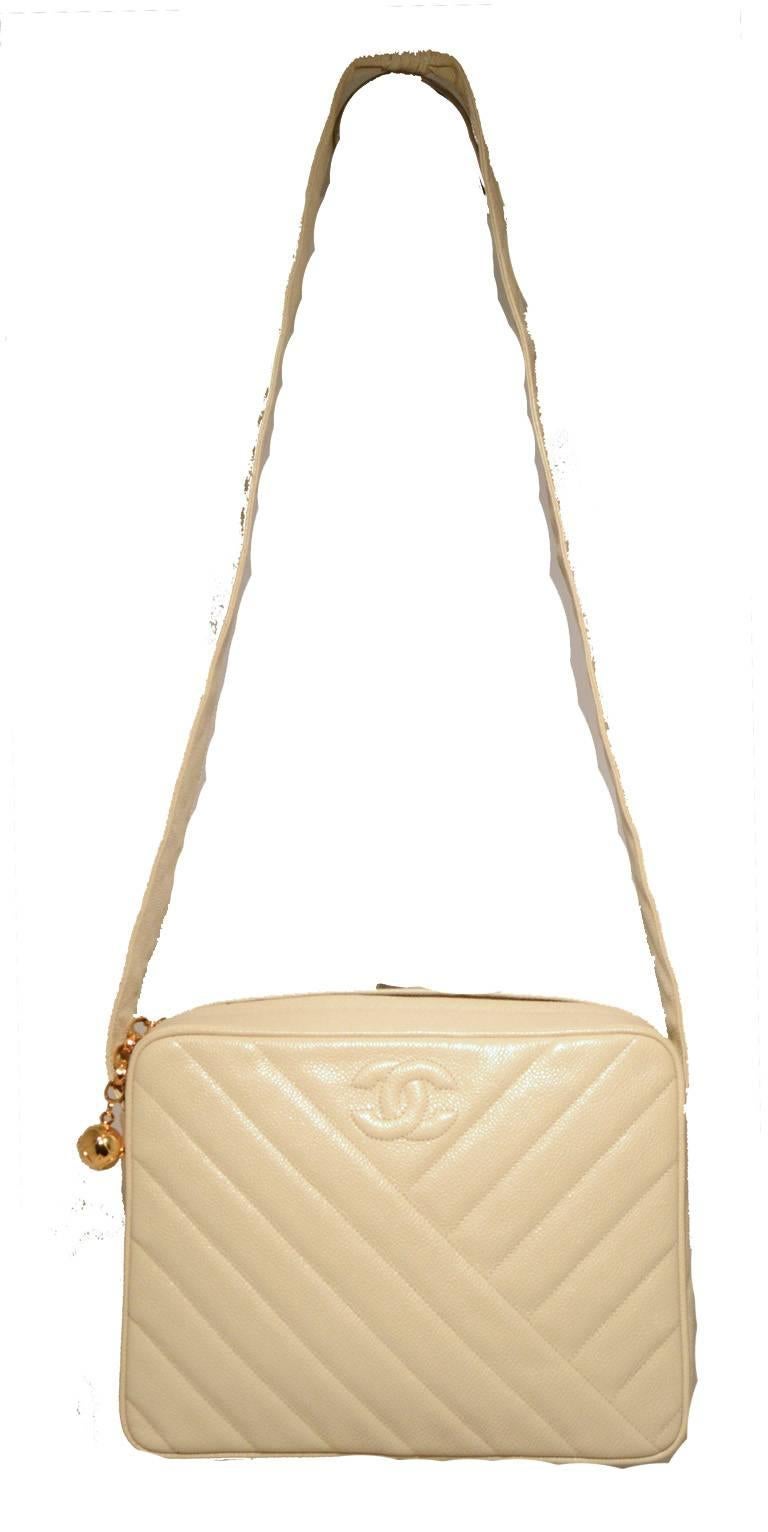 FABULOUS CHANEL vintage cream caviar shoulder bag in excellent condition.  Cream caviar leather exterior quilted in a diagonal pattern and trimmed with gold hardware.  Top zipper closure opens to a cream leather lined interior that holds 1 zippered