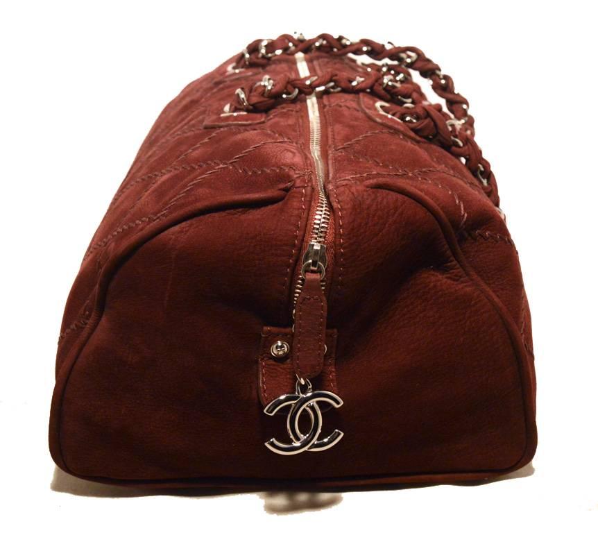 GORGEOUS Chanel maroon suede tote in excellent condition.  Maroon suede leather exterior with topstitch pattern in the signature diamond shape trimmed with silver hardware.  Double woven chain and leather straps. Top zipper closure opens to a