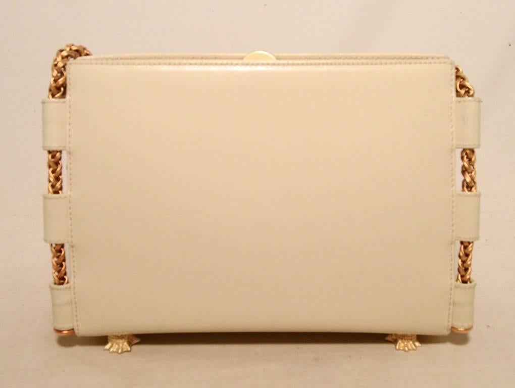 Beautiful Barry Kiselstein-Cord cream leather shoulder bag in excellent condition.  Cream box calf leather exterior trimmed with matte gold hardware and a long chain shoulder strap.  Top lifting closure opens to a dark green suede lined interior