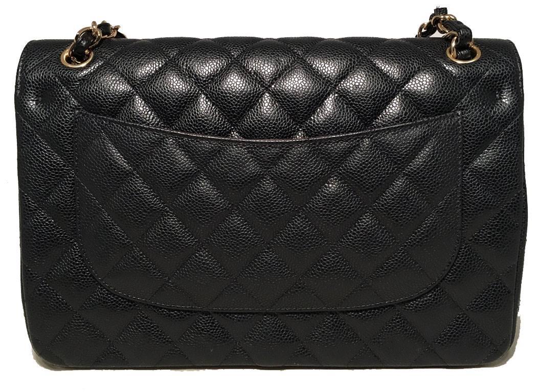 CLASSIC Chanel black caviar 12 inch 2.55 double flap classic in excellent condition.  Black caviar leather trimmed with gold hardware and woven chain and leather shoulder strap. Front Twist CC logo closure opens via double flap to a maroon leather
