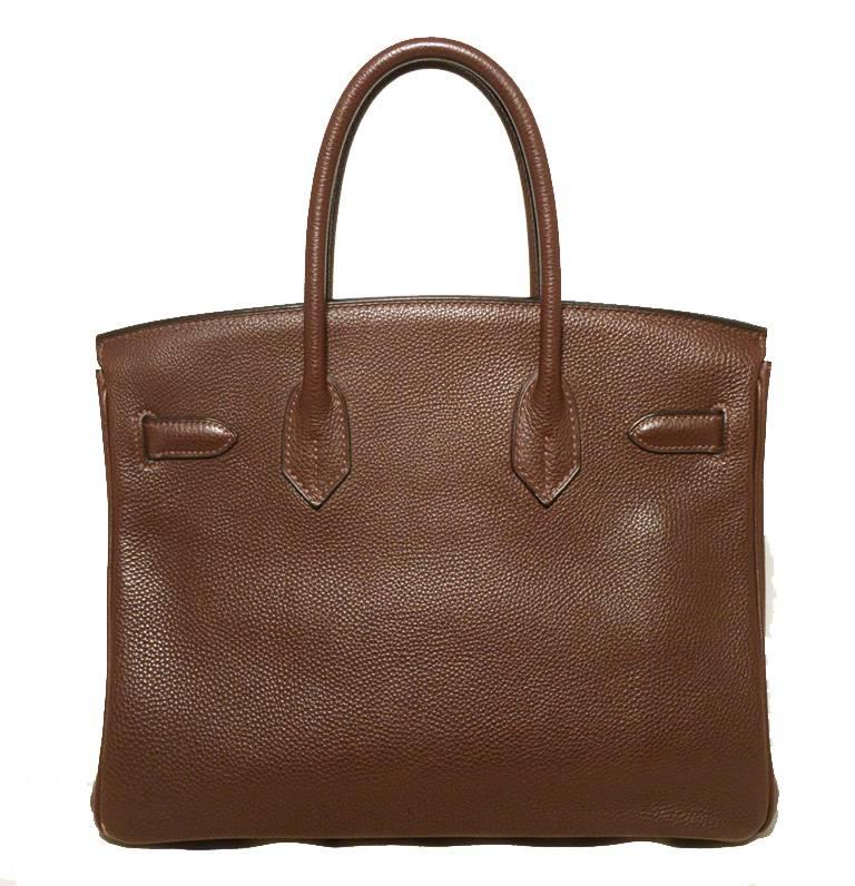 Authentic Hermes 30cm brown clemence leather birkin bag in very good condition.  Chocoloate brown clemence leather exterior trimmed with shining silver palladium hardware. Twist double strap closure opens to a brown leather lined interior that holds