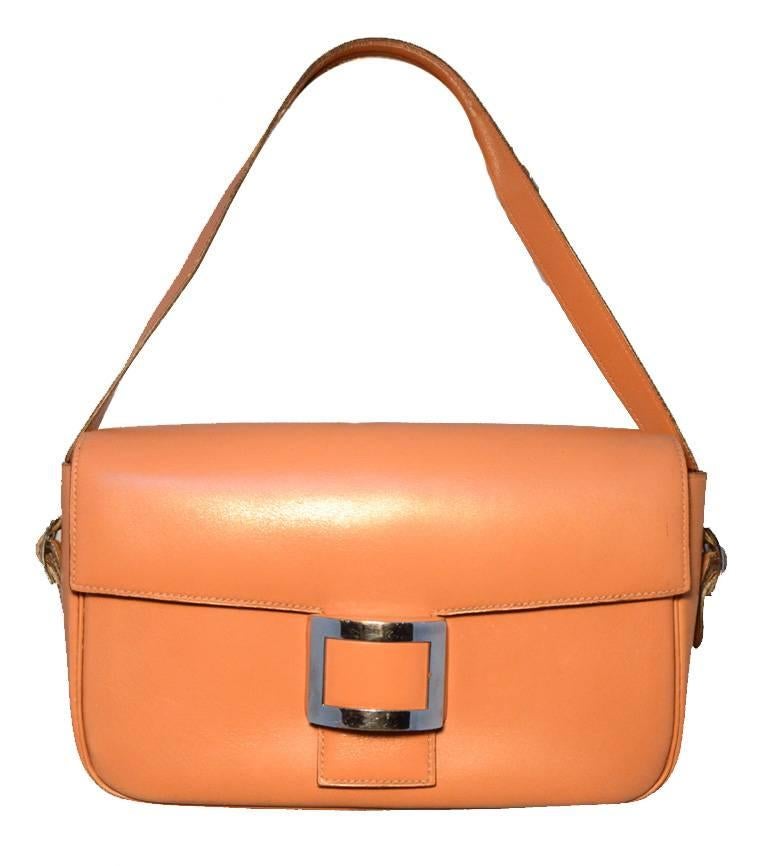 Authentic Hermes vintage tan leather shoulder bag in good vintage condition. Tan vache leather exterior trimmed with silver buckle hardware. Interchangeable shoulder strap can be worn short or long to suit your individual style. Front flap closure