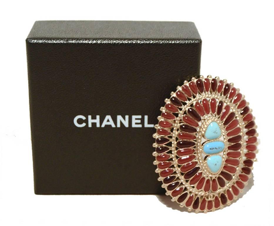 RARE and BEAUTIFUL CHANEL turquoise and burgundy semi precious stone brooch pin in excellent condition.  Set in silver, 3 center turquoise stones surrounded by 2 rows of smaller burgundy and deep red oval stones.  Perfect size for lapels, coats,