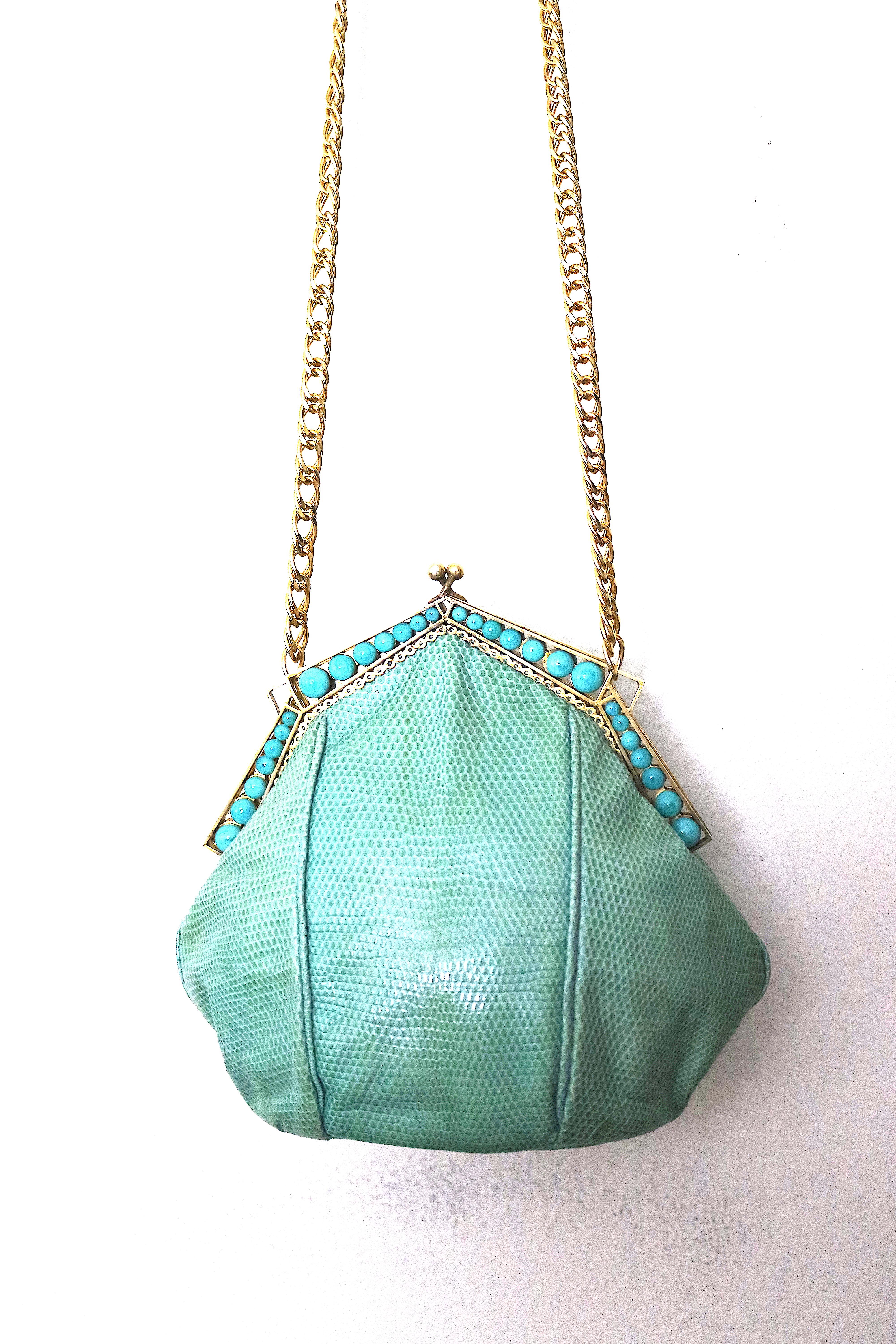 Gorgeous Gold Plate Art Deco 1930s Evening Handbag 
Frame with later added Snakeskin body. The antique 
meets the latest style and together it is a 'WoW' and a treasure.

Faux Turquoise Beads Line both the Front and Back Gold Plate Frame