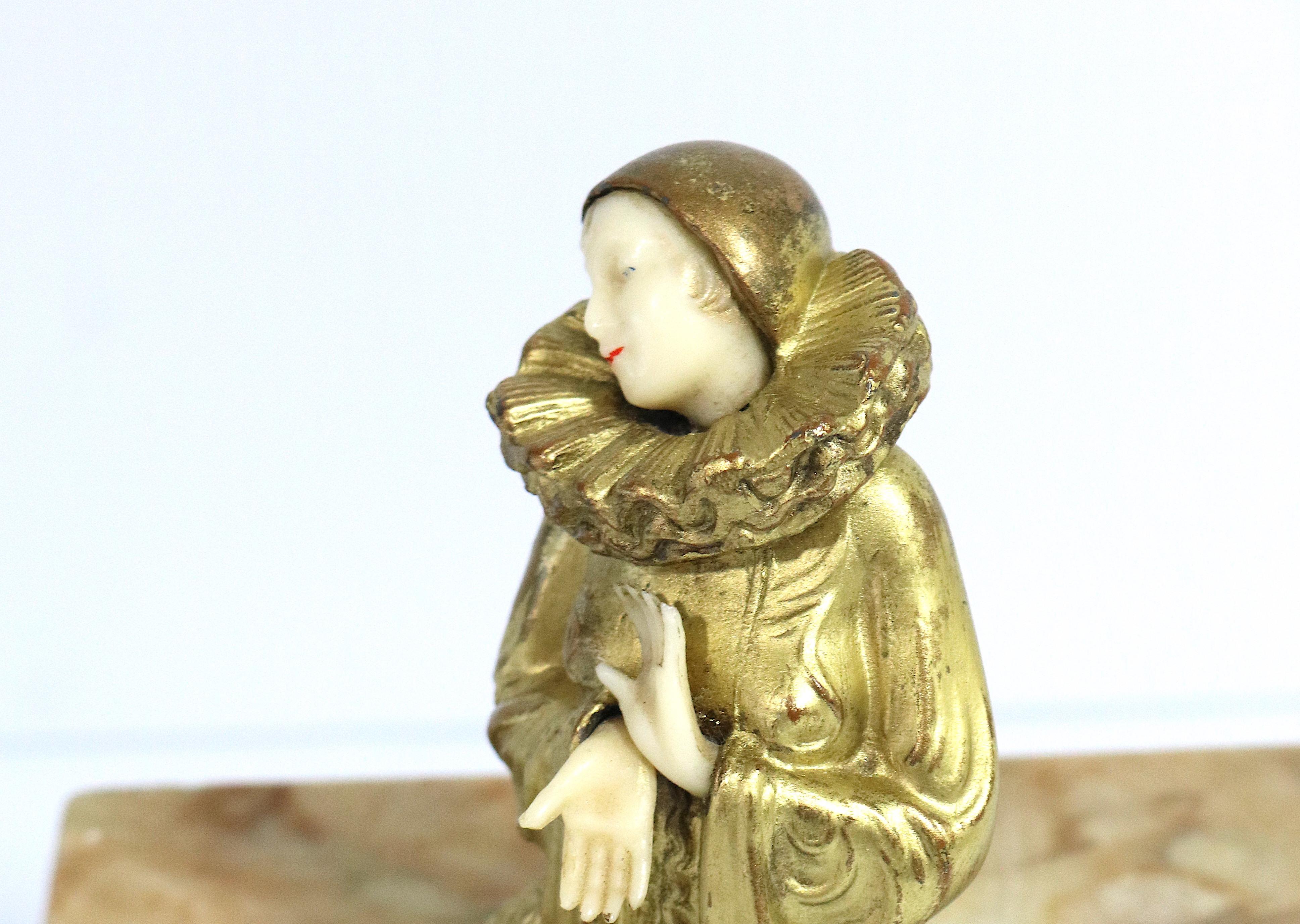 A lovely Art Deco Pierette Gilt Sculpture attached to a Marble Box.
After the sculptor Paul Phillipe circa 1930s. unmarked
The beautiful lady has a charming well defined ivorine face and hands.
The top of the box is purposefully offset on the box,