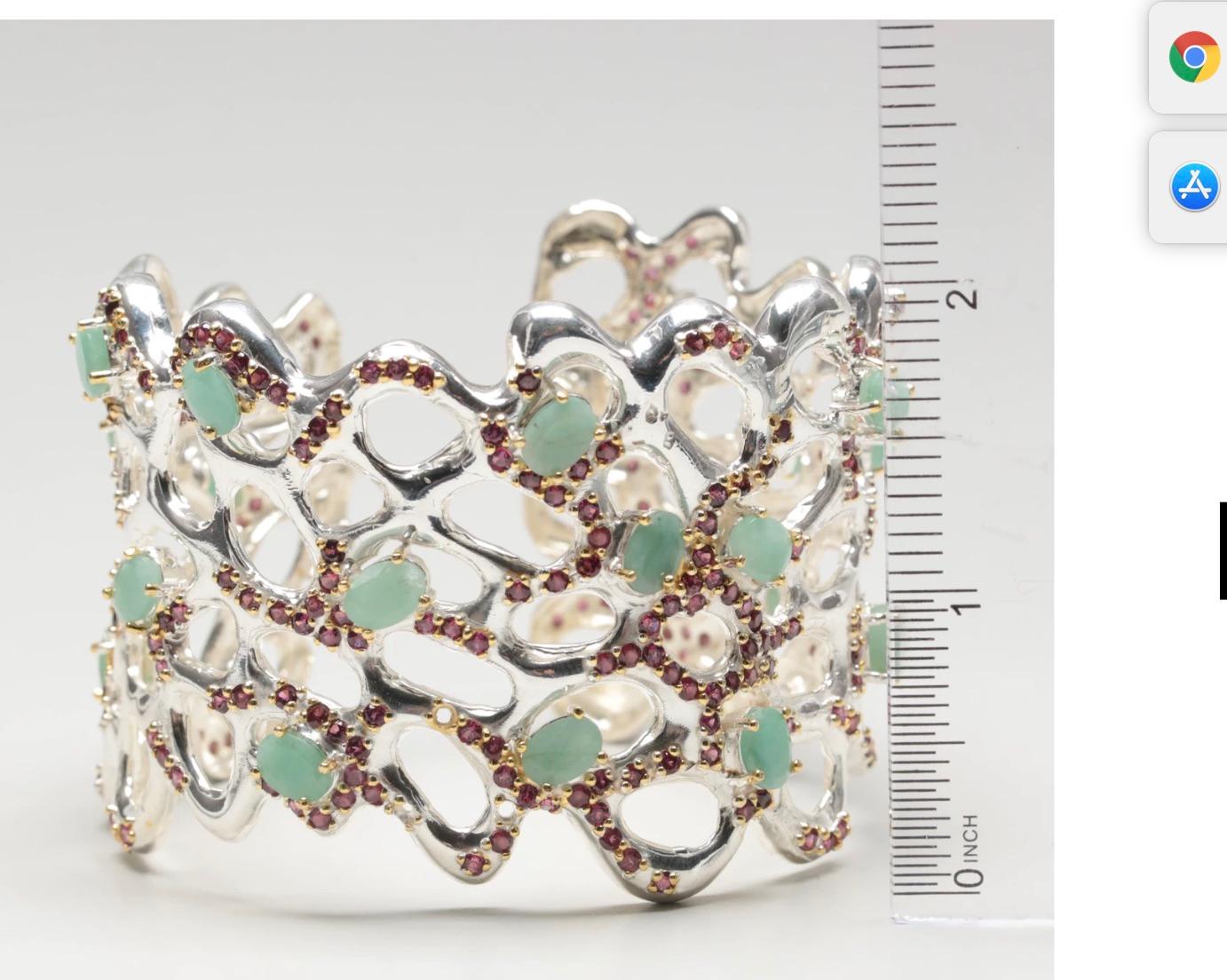 Made to Impress and Fall in Love!!!
Stunning Open Work Sterling Silver Cuff Bracelet with Emeralds, Rhodolite Garnets and Sapphire by an unknown but inspired jewelry designer. Matching earrings and ring available 

Materials:	Sterling silver
Stone