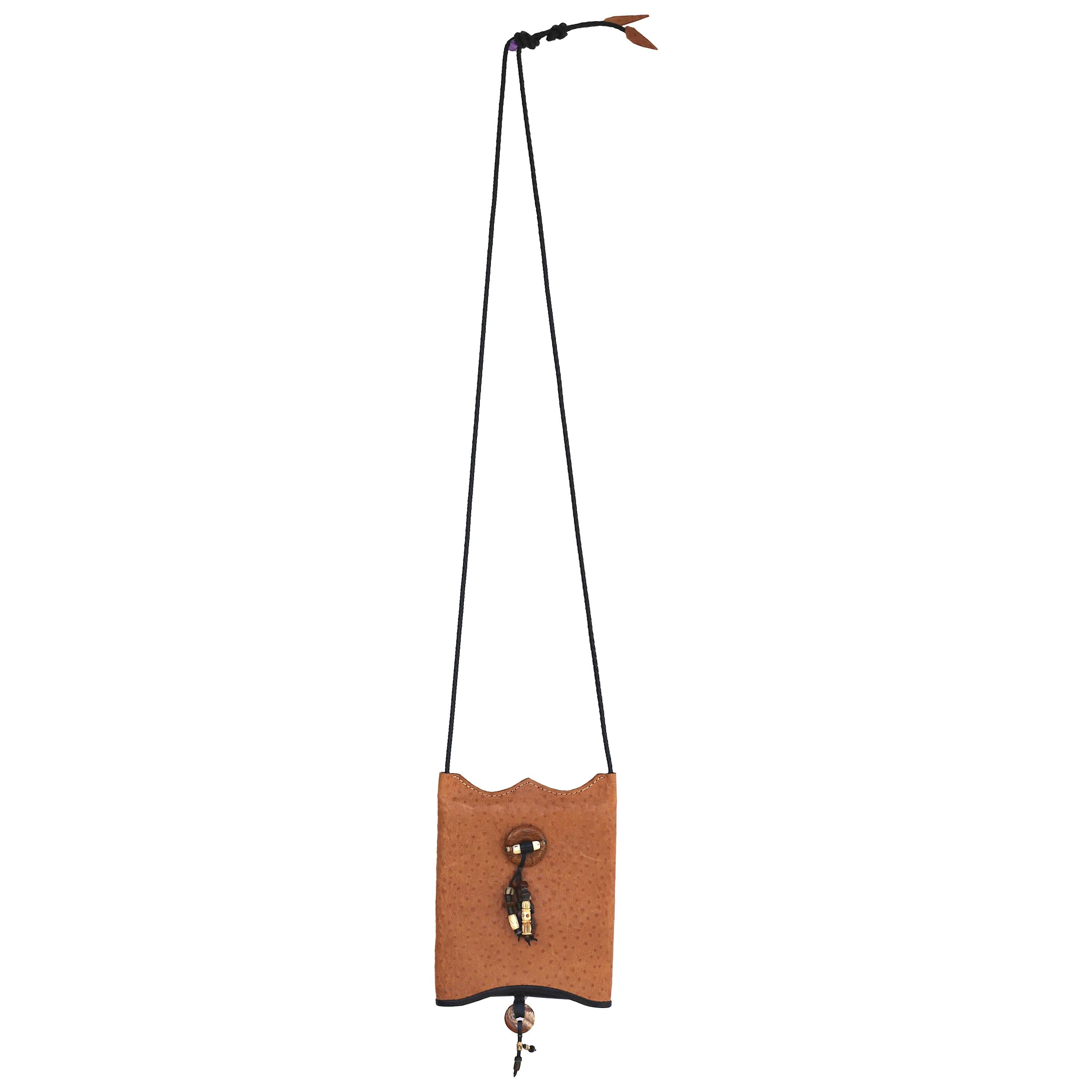 Save your back while safely traveling in sophisticated style.
A light weight Chic Vintage Exotic Tan Ostrich and Black Leather Crossbody Bag-holds your cellphone, some money, and a few credit cards, then go on your way safe and sound.
A Fashionable