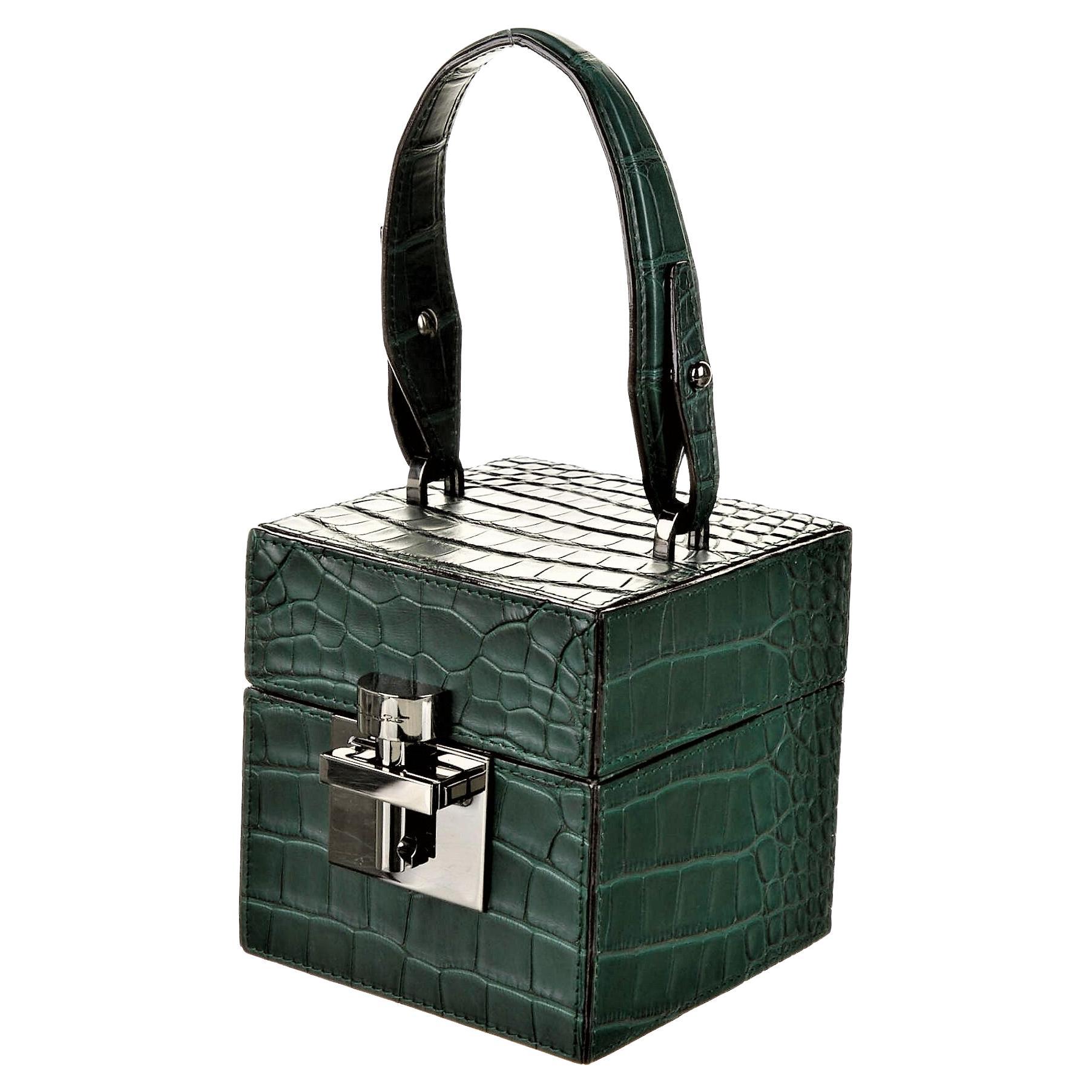 Oscar De La Renta
Brand New with Box & Tags
$9690
* Absolutely Stunning!
Emerald Green Genuine Alligator
Silver Hardware
Flat Handle & Chain-Link Shoulder Strap
Suede Lining with Card Slot
Push-Lock Closure at Front

THE ALIBI CUBE IS CRAFTED FROM