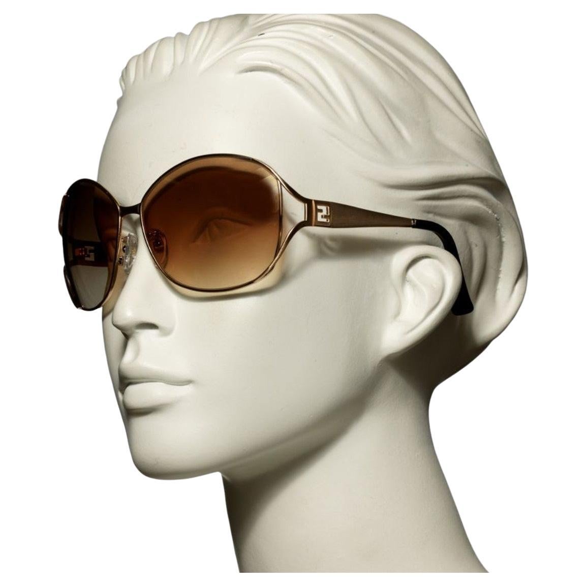 New Fendi Gold Aviator Sunglasses with Case

Brand New
Fendi FF Logo at Sides
Beautiful Gold Frames
Lightweight Scratch and Impact Resistant
Made in Italy
100% UVA/UVB Protection
With Case & Cleaning Clothing