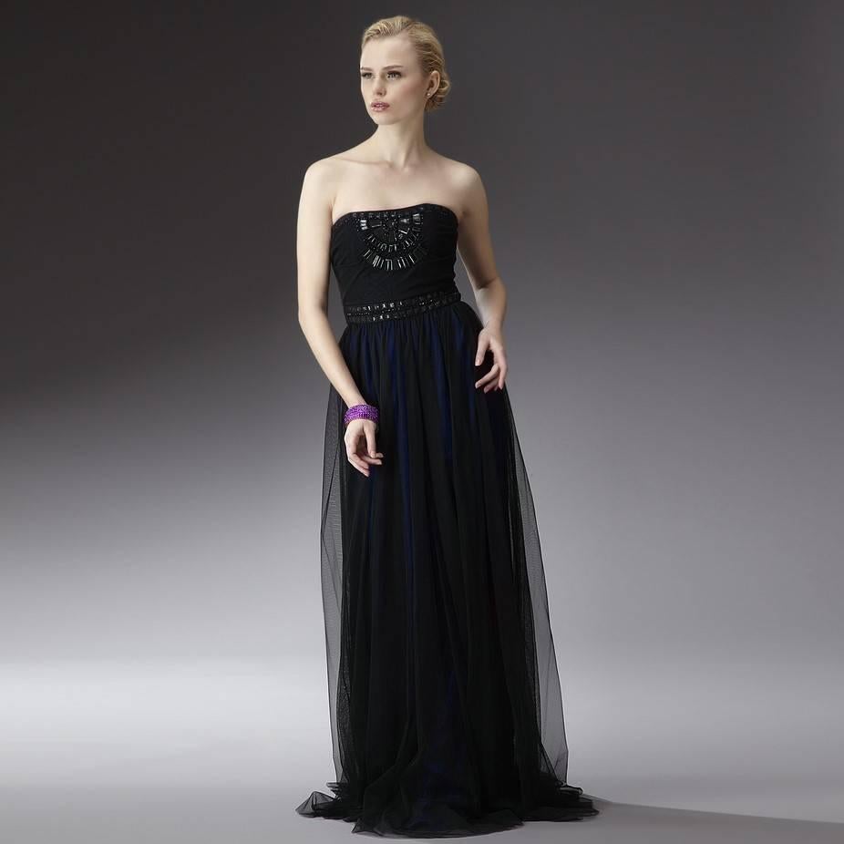 Badgley Mischka Gown
Brand New with Tags
Size: 4
100% Black Nylon Overlay
100% Silk Midnight Blue Shell 
Midnight Blue Silk & Black Nylon Overlay Dress
Midnight Blue Silk Shell Shows Through the black Nylon for a Beautiful Color 
Zipper and Hook