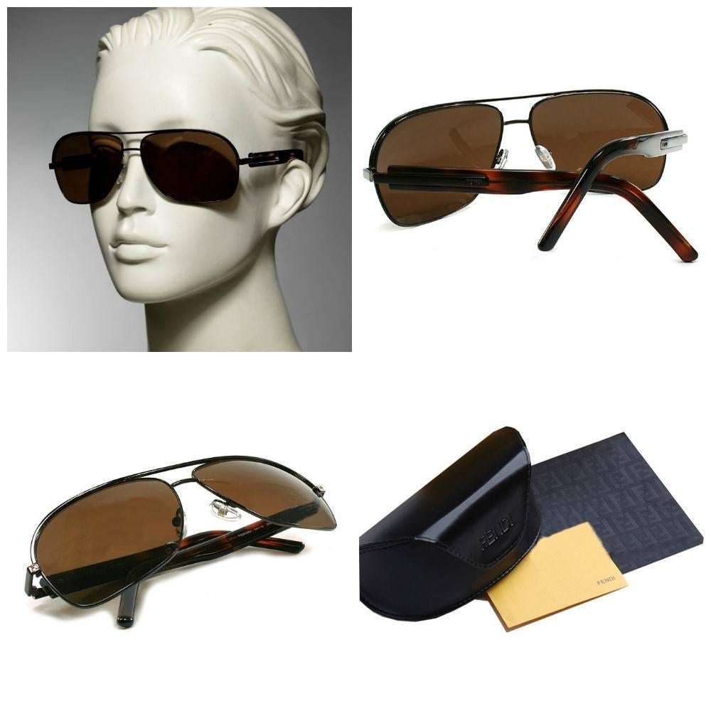 Fendi Aviator Sunglasses
Brand New
* Brown Aviator Frames ~ Unisex
* Fendi FF Logo Temples
* Tortoise Sides
* Model Number: FS5038M 208
* Lightweight Scratch & Impact Resistant
* Made in Italy
* 100% UVA/UVB Protection
* Comes with Case & Cleaning