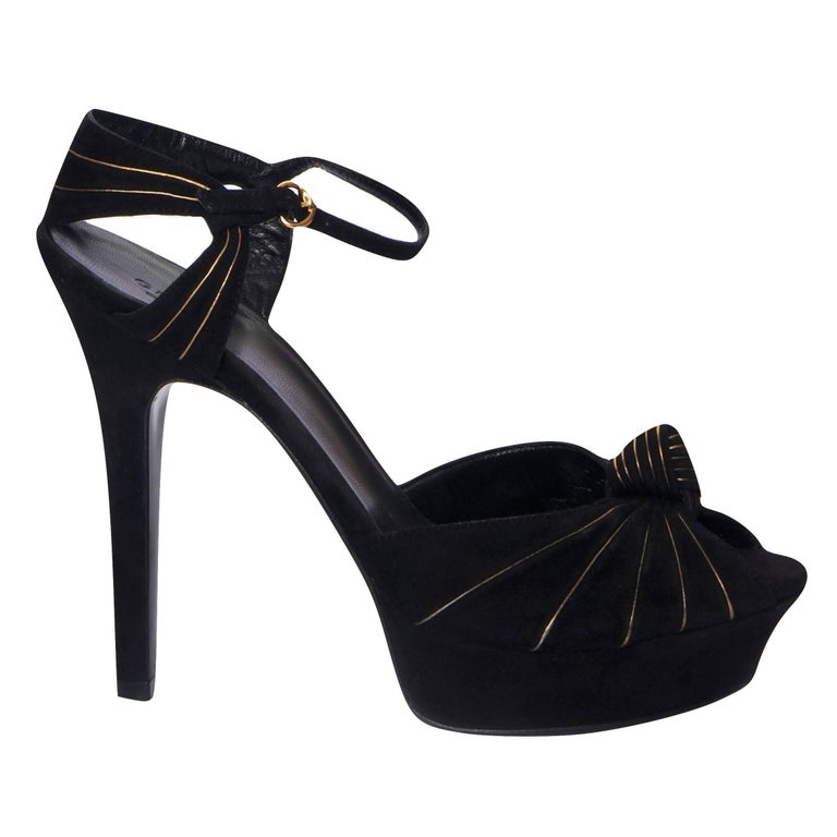 Gucci Platform Heels
Rare Fall Winter 2007
Brand New with Minor marks to soles from being tried on
* Stunning Suede Platforms
* Black Suede
* Gold Wire Threading
* Size: 7.5
* Knot Detail at Toe
* Leather Footbed
* 1.25