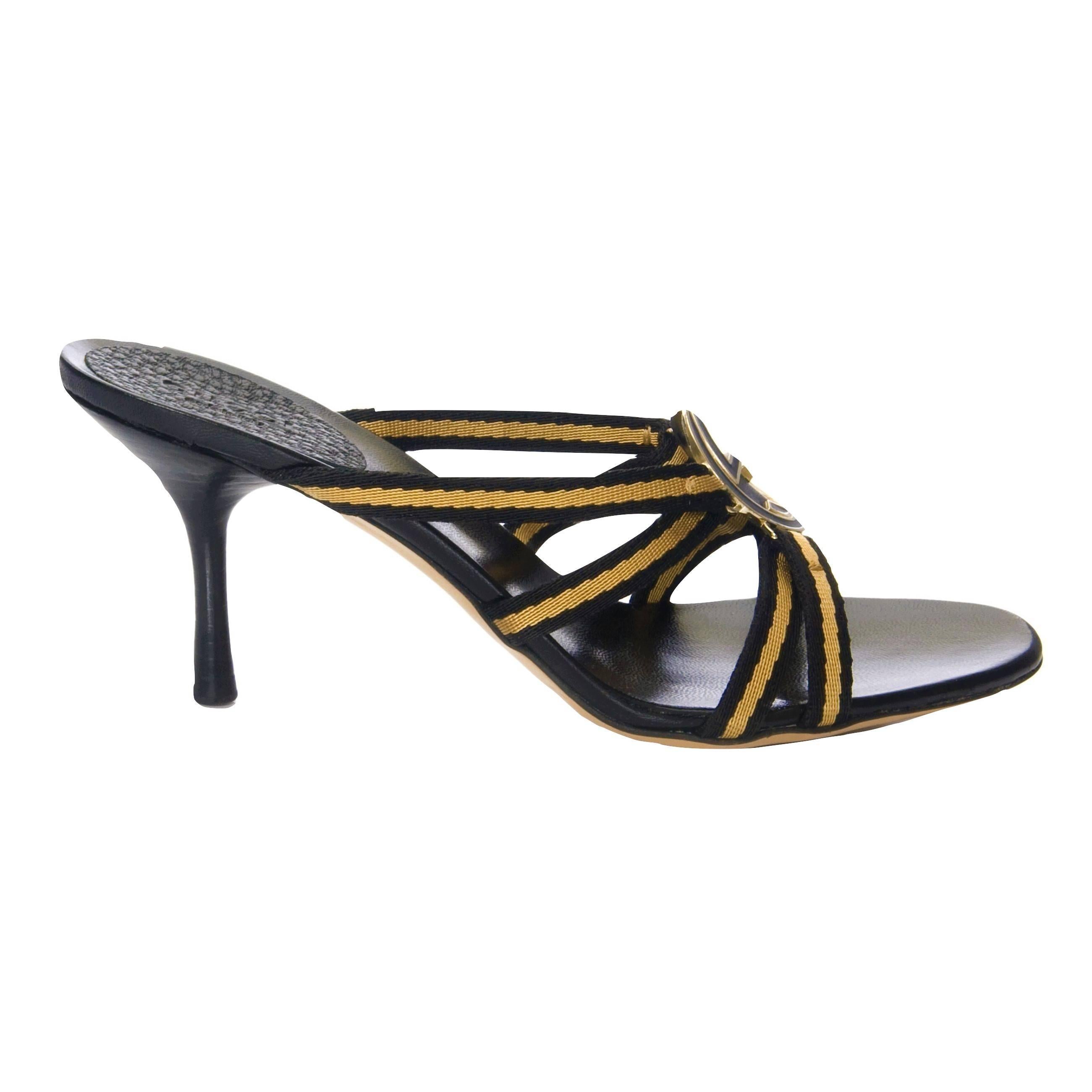 Tom Ford for Gucci GG Logo Heels
Brand New
* Stunning in Gold & Black
* Gold & Black GG Logo Front 
* Size: 7.5
* Yellow & Black Canvas Straps
* Leather Insole 
* 3.25