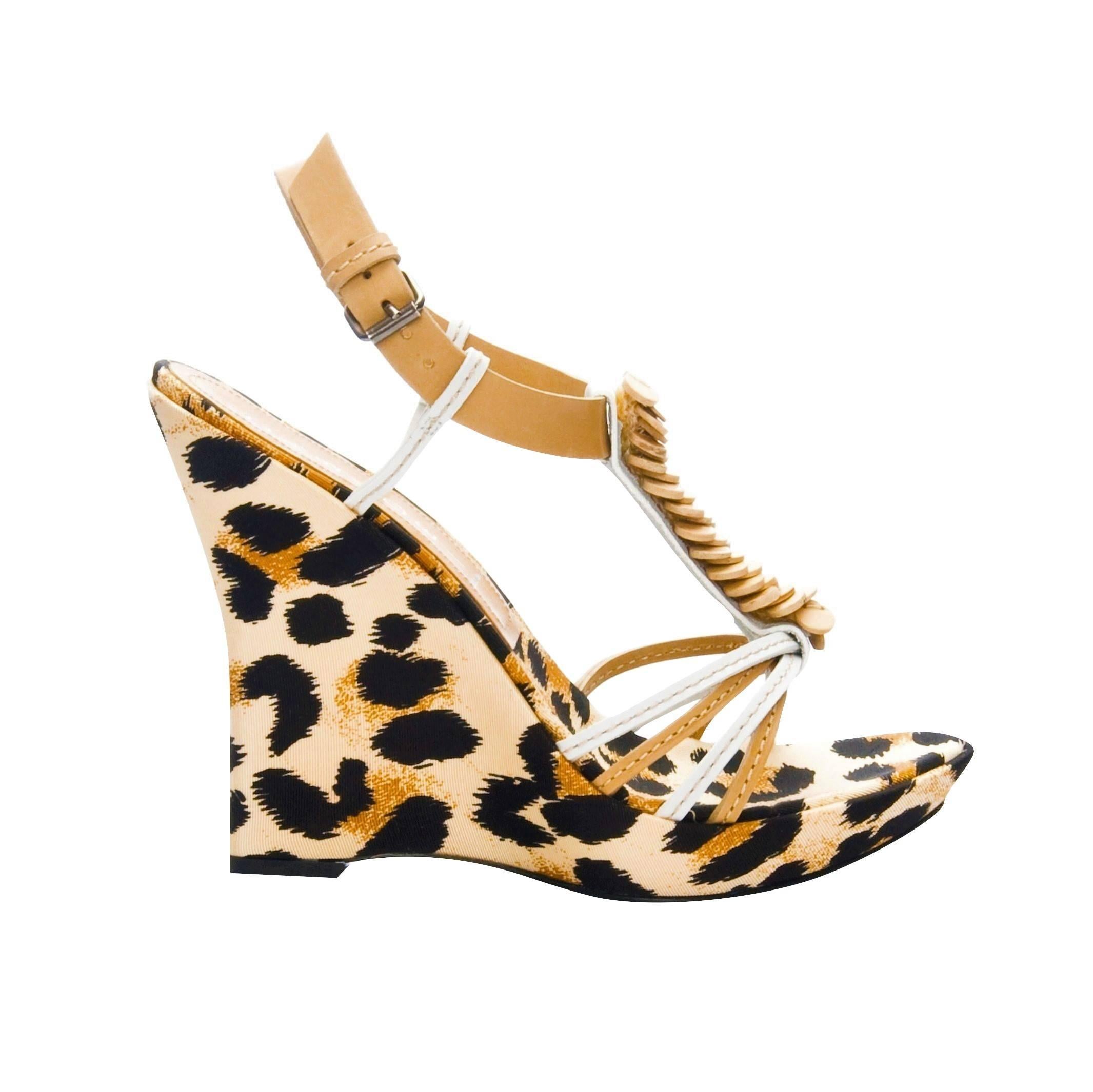 Casadei Leopard Platforms
Brand New
Please Note: We feel these run a half size small.  
* Cream, Brown & Black Leopard Print
* Fabric Leopard Print Footbed
* Beige & White Leather Straps
* Wood Detail T Front
* 1/2
