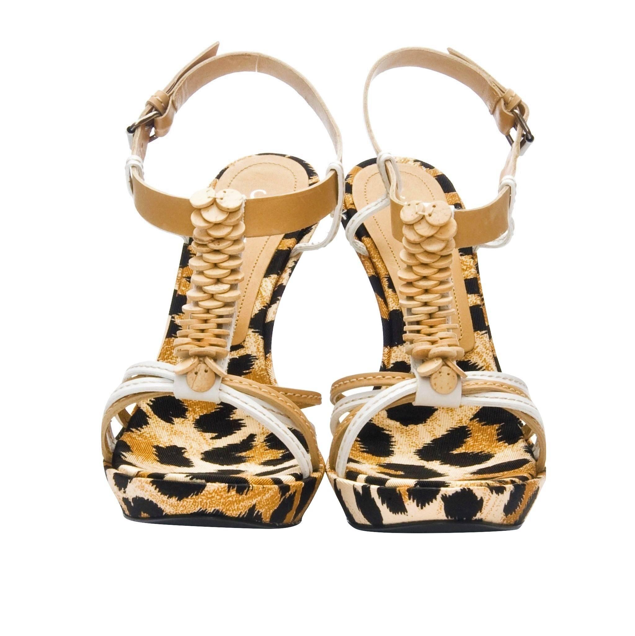 Casadei Leopard Platforms
Brand New
Please Note: We feel these run a half size small.  
* Cream, Brown & Black Leopard Print
* Fabric Leopard Print Footbed
* Beige & White Leather Straps
* Wood Detail T Front
* 1/2
