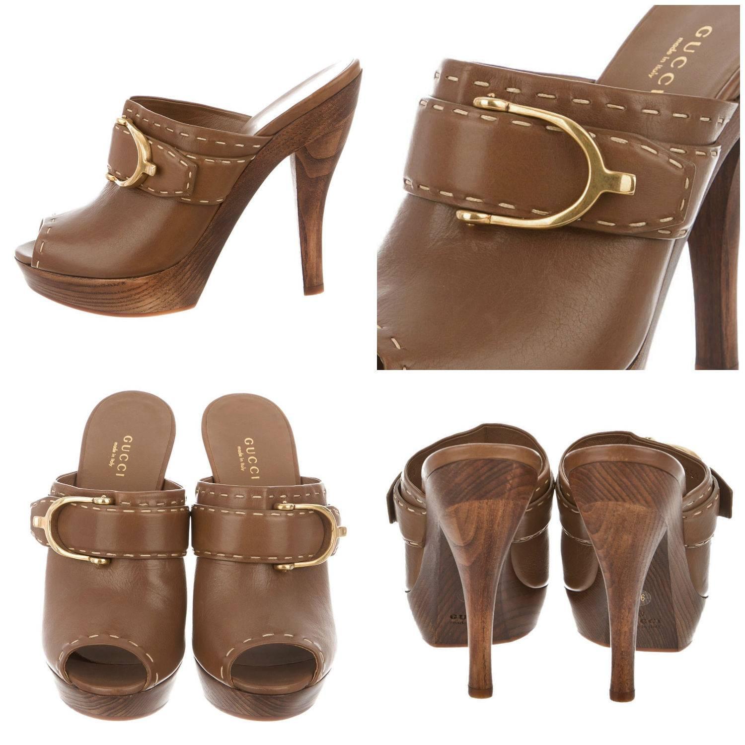 Leather Gucci Heels
Brand New
* Brown Leather Peep Toe
* Clogs ~ Mules
* Size: 36 
* Wooden Heel
* Contrast Stitching
* Gold Horsebit
* 5