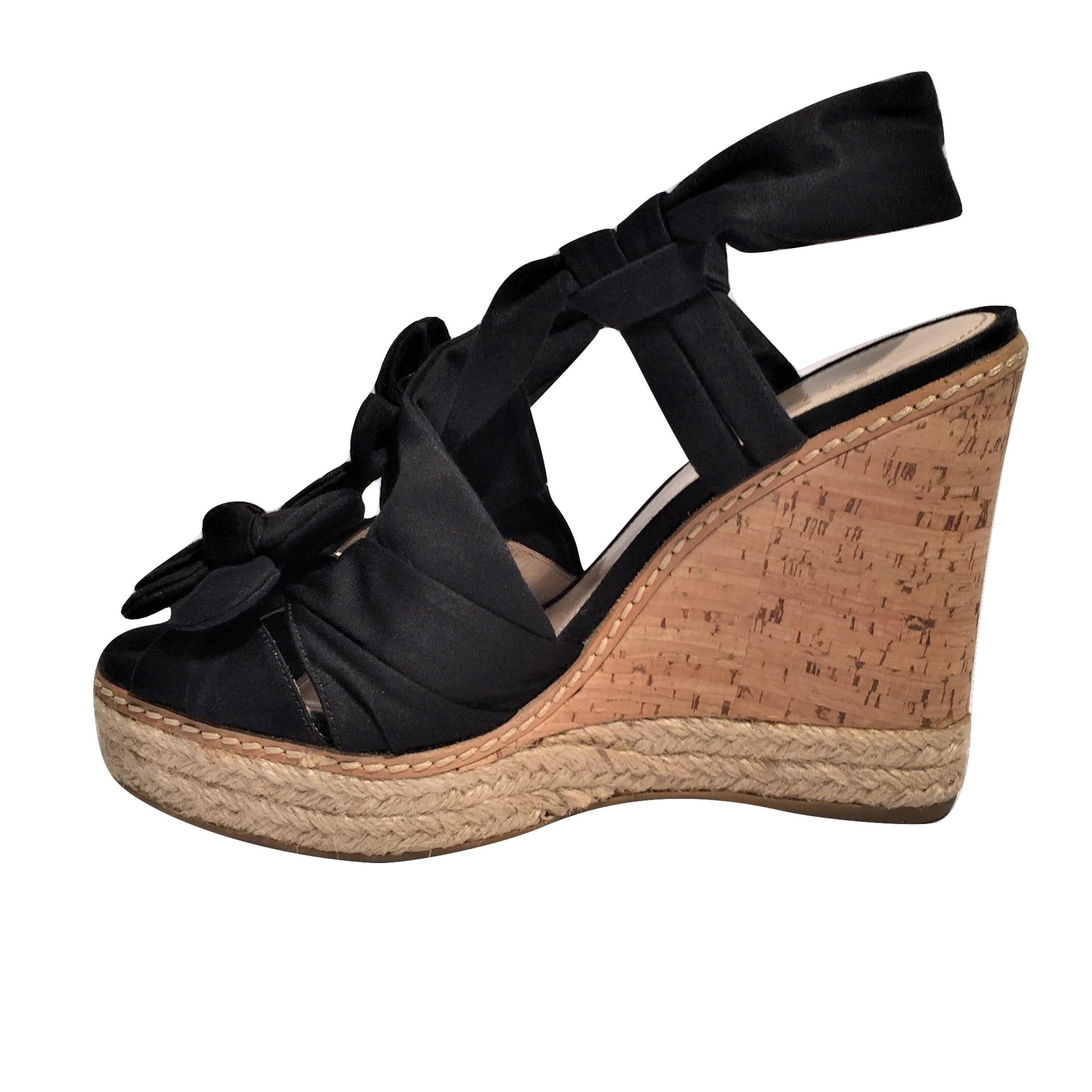 Prada Wedge Espadrilles

Excellent Condition! Worn Once!
*Beautiful Prada Wedge Heels
*Black Nylon Fabric
*Flower Detail
*Leather Insole
*4.5