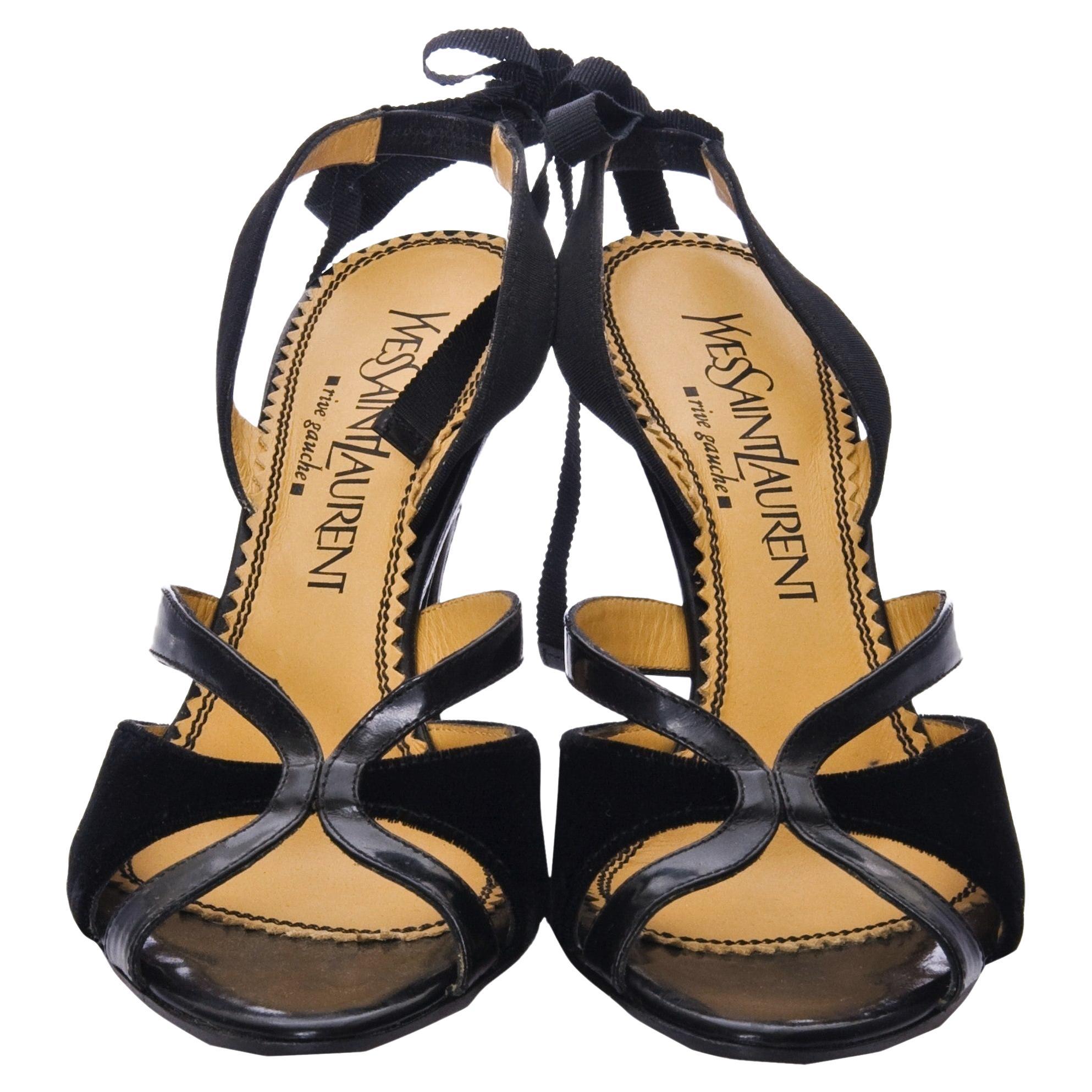 Tom Ford For YSL Heels
Brand New
* Stunning Black Leather & Velvet
* Tom Ford's Final Years w/ YSL
* Euro Size: 36.5 
* Ribbon Can be Tied Around Ankle or Accented at Back
* Leather Insole 
* Velvet & Leather Toe 
* 3.5