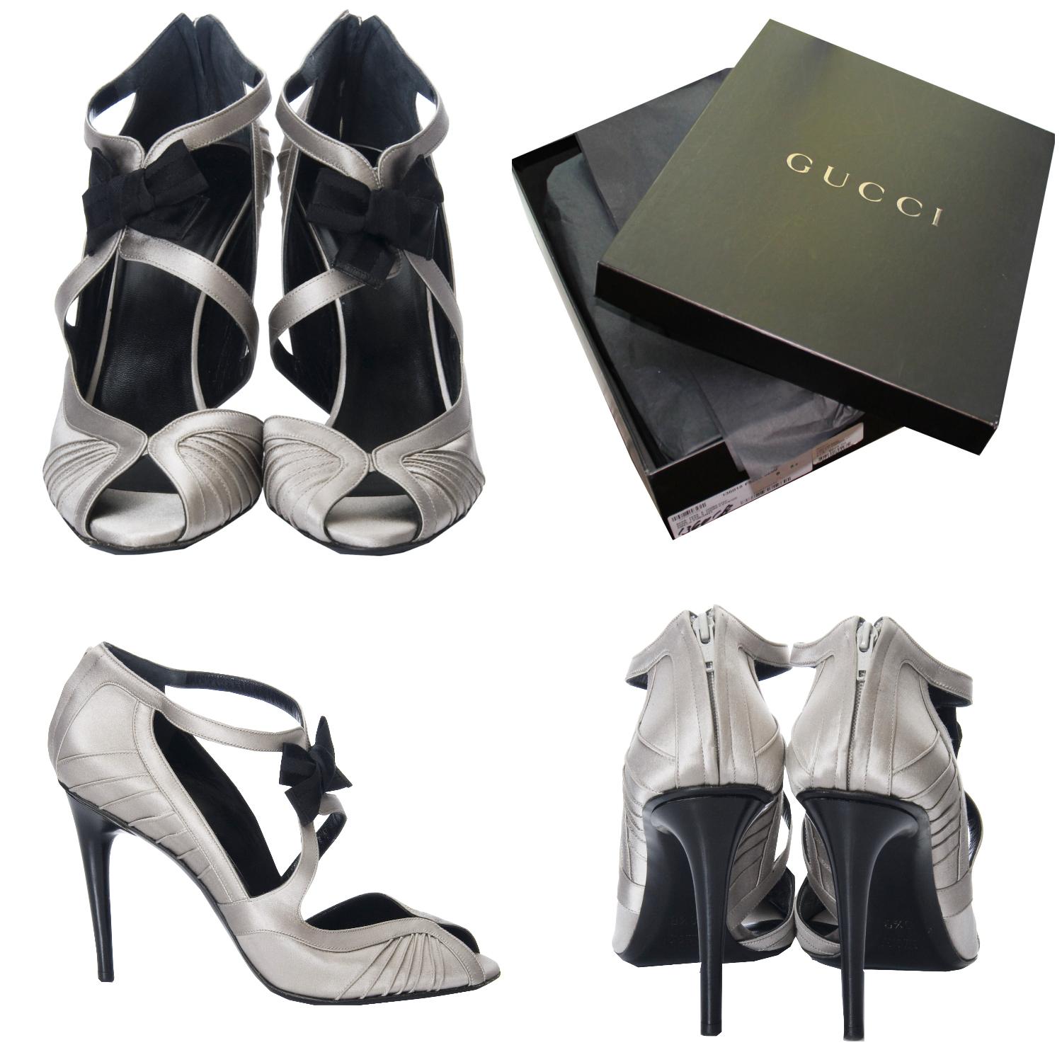 Tom Ford For Gucci Heels
Brand New
As Seen on Sarah Jessica Parker
* Stunning in Silver Satin
* Tom Ford for Gucci
* Size: 8.5
* Black Satin Bow at Front
* Leather Insole 
* Zips up the Back 
* 4