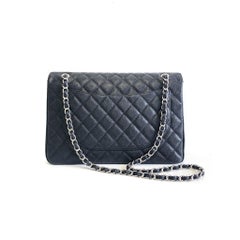 Chanel Single Flap Maxi in black caviar leather with silver hardware