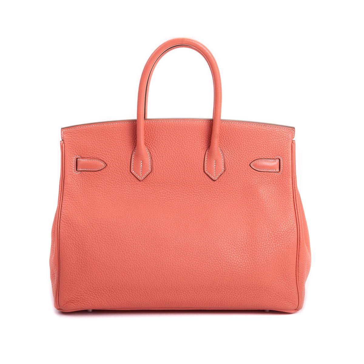 The iconic Hermes Birkin is a must have for any designer handbag collector. Keep your belongings safe with the lock and clasps, plus perk up your wardrobe in this beautiful Crevette shade.

The handbag has been worn twice, but aside from a light
