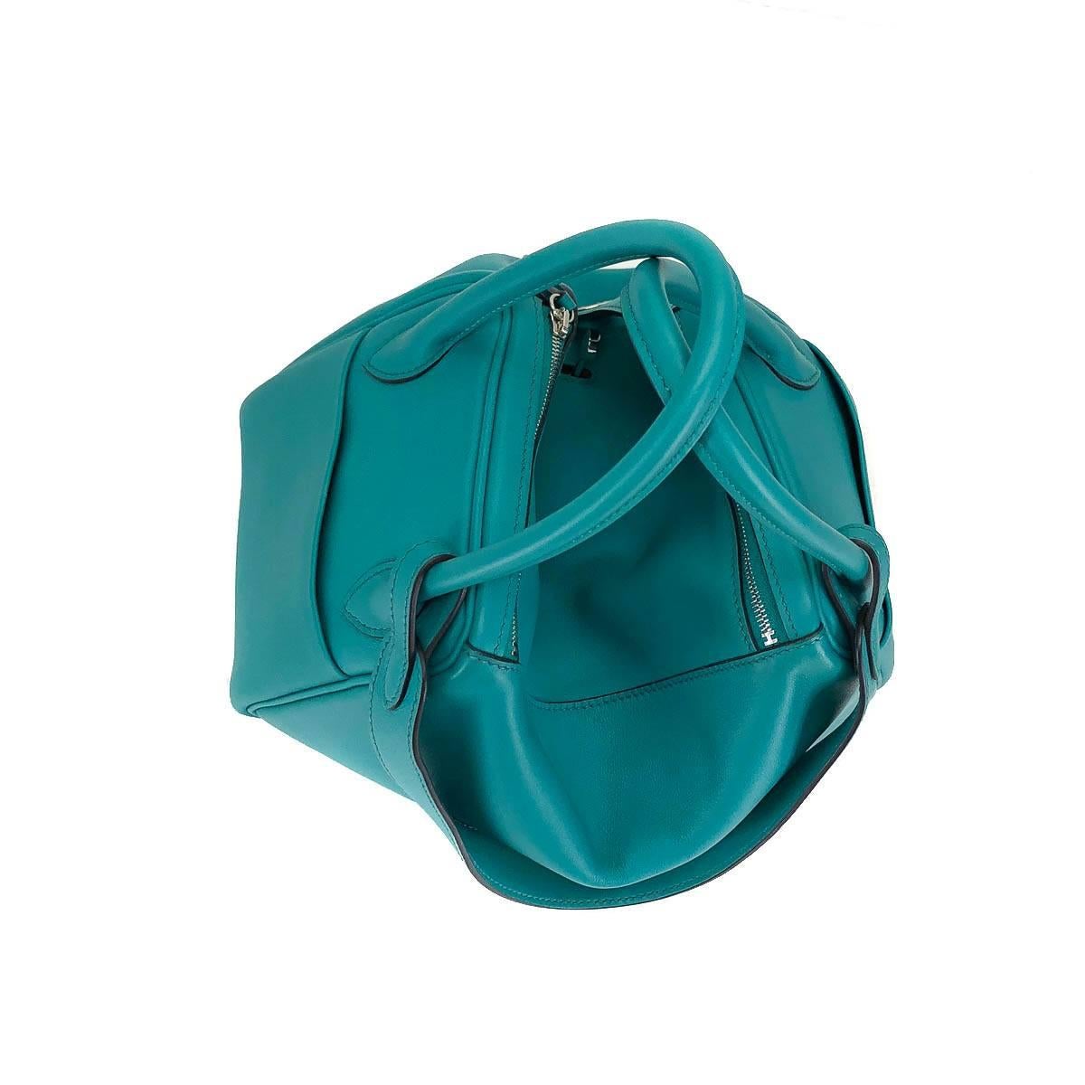 This gorgeous Hermes handbag is as functional as it is adorable. With a roomy interior and generous square shape, the Hermes Lindy 26 handbag will hold your essentials and then some. Stand out with this eye catching Blue Lagoon shade in a unique