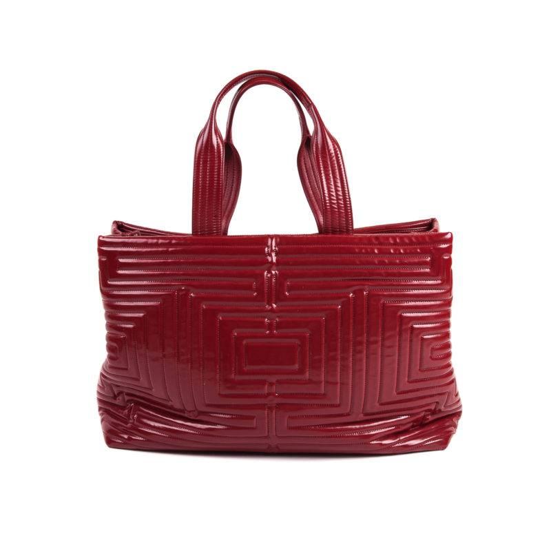 If you’re looking for the perfect beach bag, look no further! This large vinyl Chanel has got you covered with ample room to store your daily necessities. Adorned with an eye catching pattern and a bright red that will sure give your outfit an extra