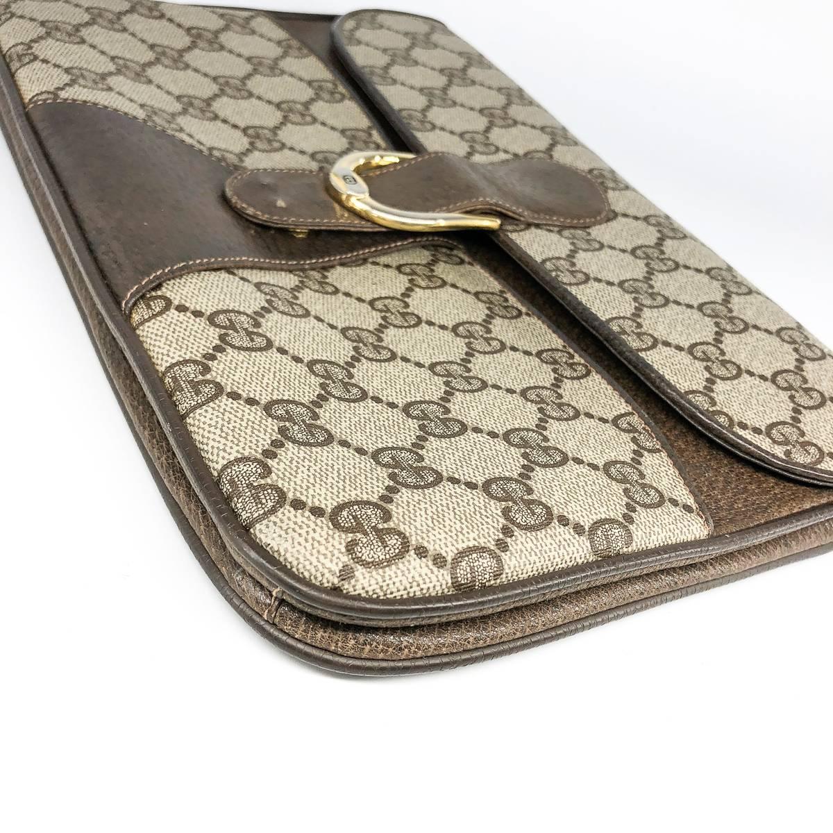 Women's or Men's Gucci Vintage GG Monogram Clutch crossbody with Strap and Gold Hardware For Sale