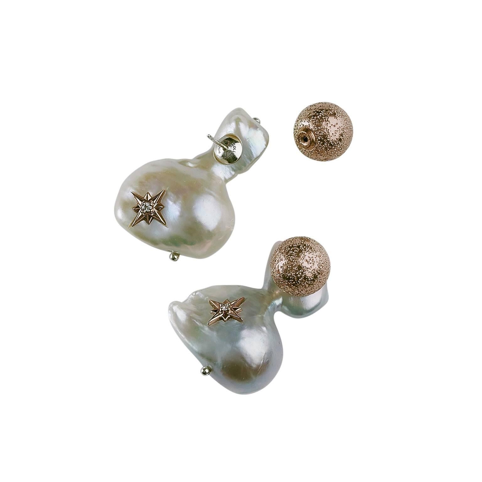 This white baroque cultured massive pearls that made up stud earring. On front sides, 12 mm diamond dust silver beads covered in 14k rose gold.
The natural formed freshwater pearl earrings measurement detail  is  32.13 x 25.91 mm  ( 1.3 x 1.02 in ),