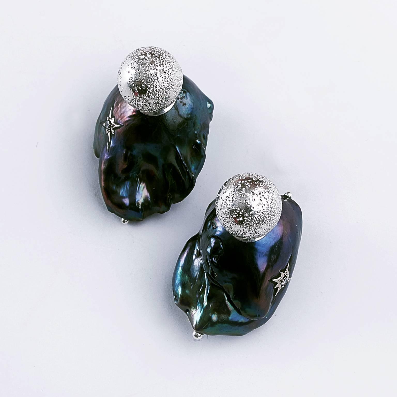 This black baroque cultured massive pearls that made up stud earring. On front sides with 12 mm diamond dust sterling silver beads.
The natural formed freshwater pearl earrings measurement detail  is  28.51 x 20.69 mm ( 1.12 x 0.81 in ), 29.22 x