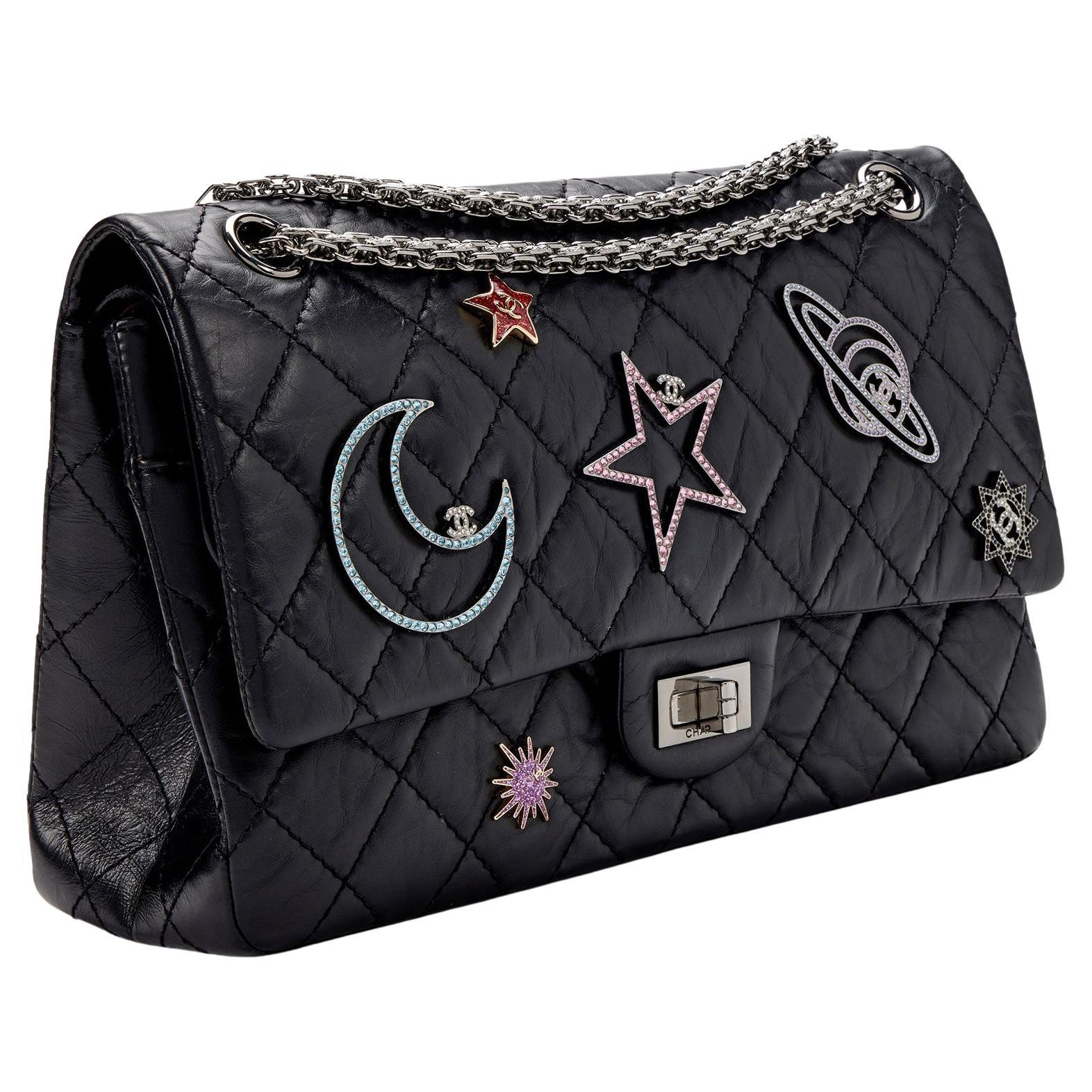 Quilted Chanel 226 reissue black lambskin space charm flap with mademoiselle closure and reissue chain

Year: 2017
Silver hardware
Space astronomy inspired charms
Interior flap zippered pocket
Interior flap
Interior open pockets
Classic back