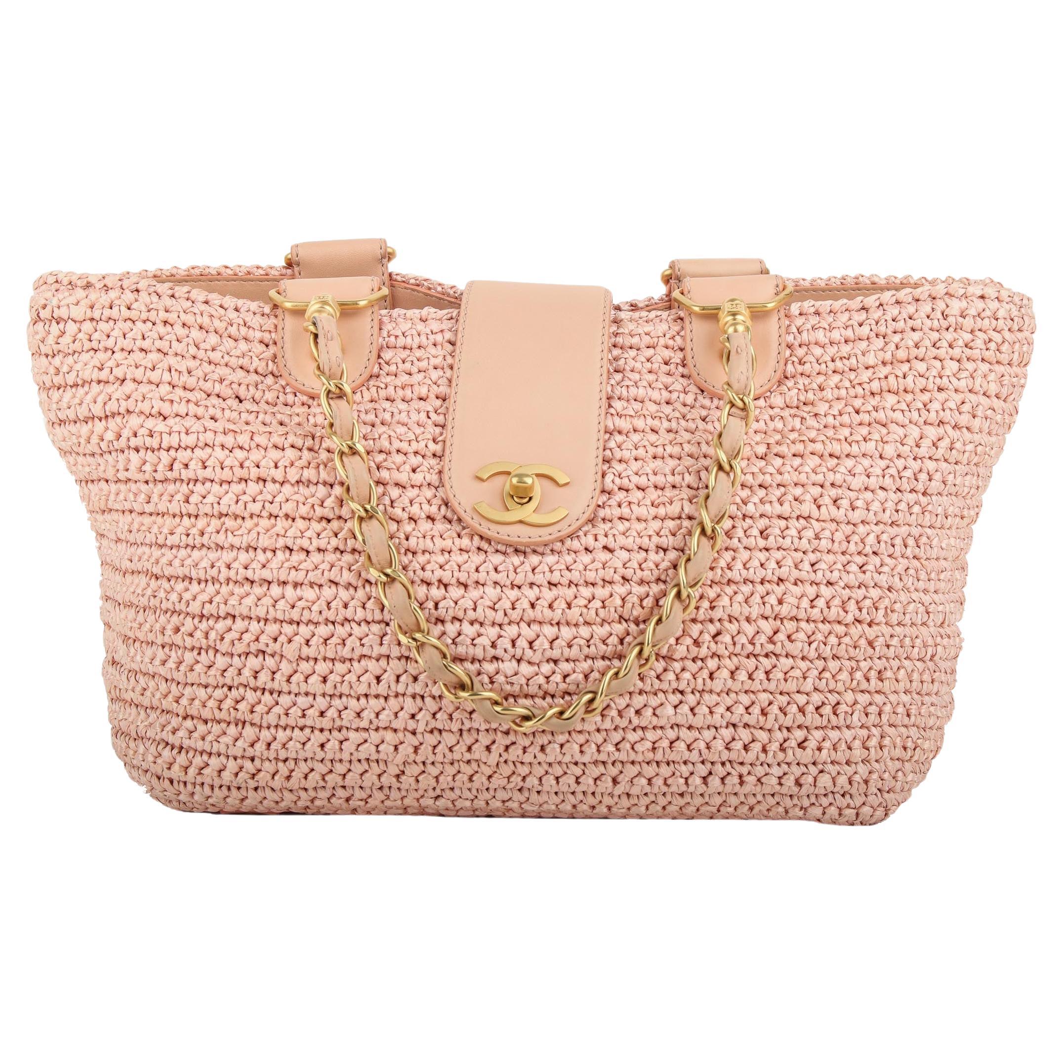 Chanel 2005 Rare Vintage Raffia Woven Pink Straw and Leather Basket Tote Bag

2005 {VINTAGE 18 Years}
Brushed gold hardware
Woven pink raffia straw
Classic interwoven chain
CC Classic Turnlock
CC pink logo fabric interior 
Interior zippered pocket