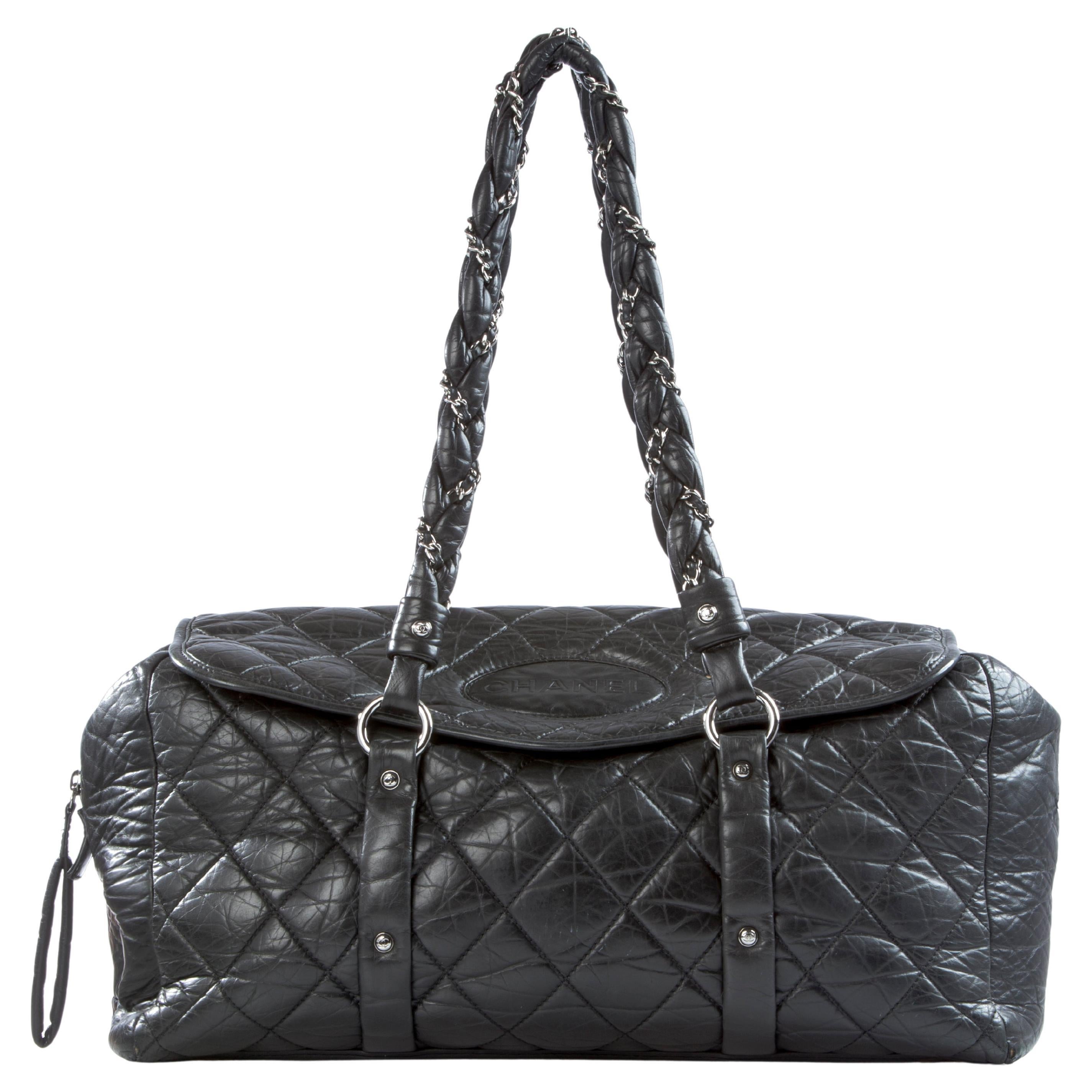Large size Chanel distressed calfskin black tote with interwoven braided straps and flap

2006 {VINTAGE 16 Years}
Silver hardware
Chanel name stamp
Double strap
Interior graffiti lining
Large hidden interior back pocket
Magnetic flap