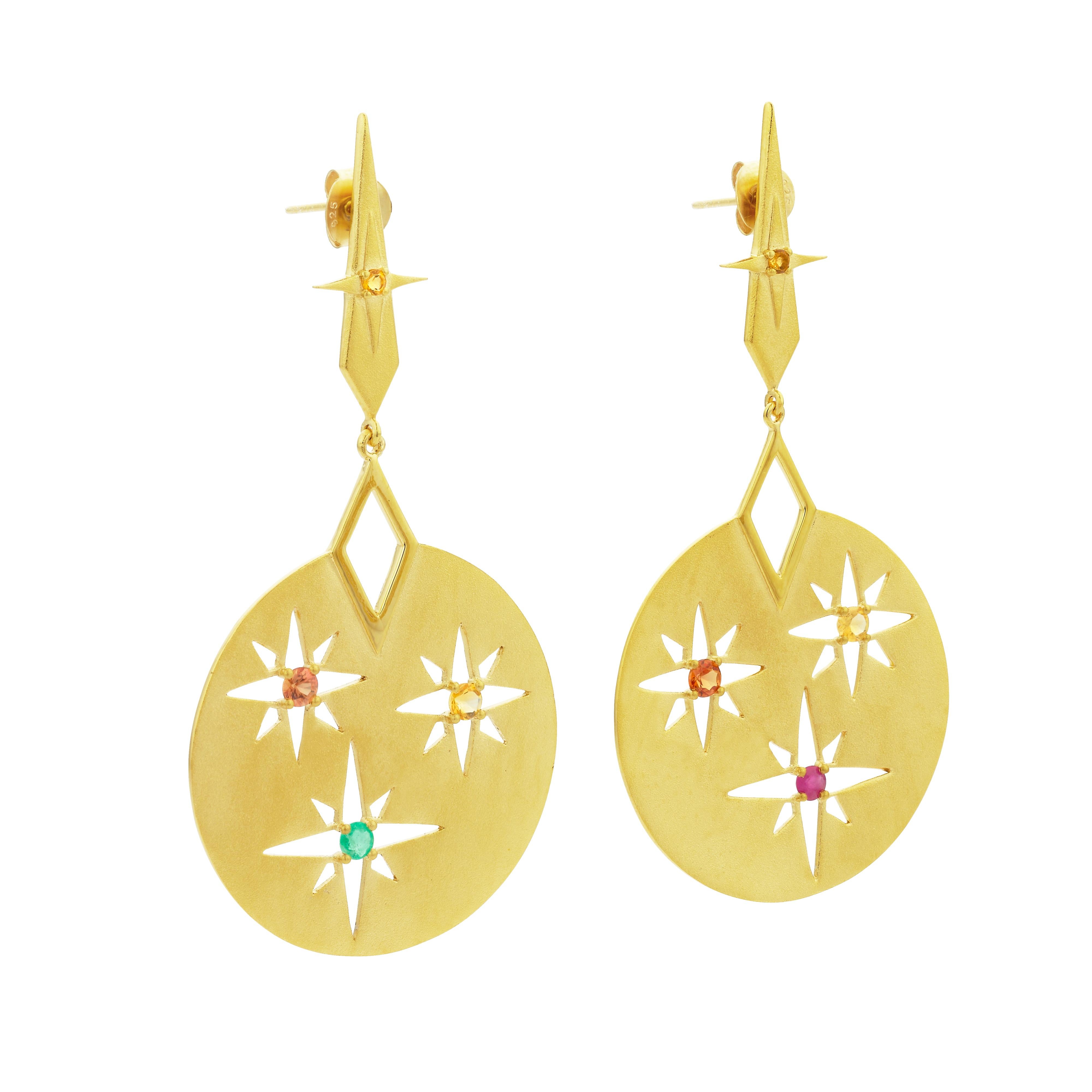 The Rising Sun earrings hold the spectrum of colours of the rising sun.
The stud set with Citrine sits high on the ear to reflect the sun at its highest point.

The elegant drop matte disk reveals the cut-out detailing of the sun with mismatched