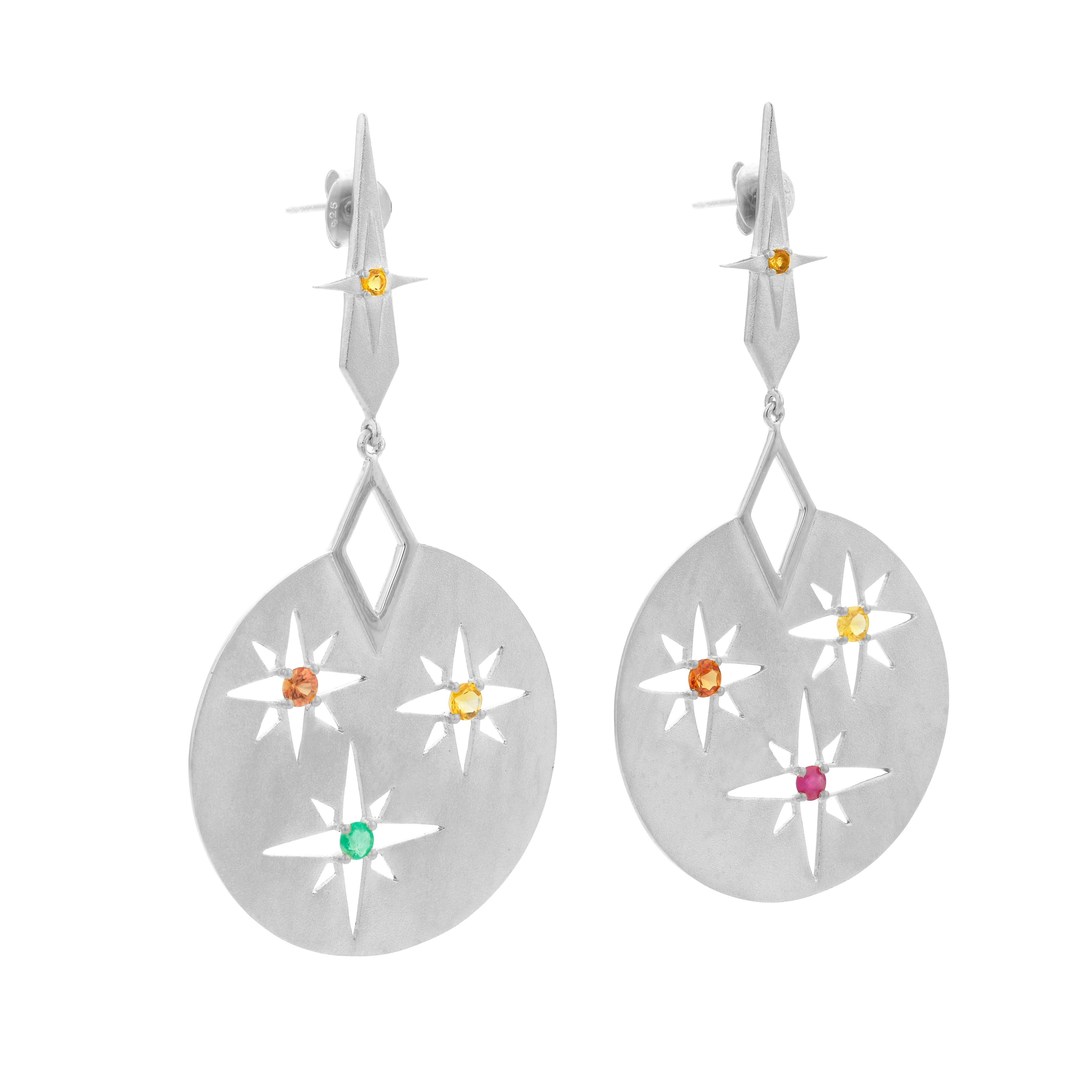 The Rising Sun earrings hold the spectrum of colours of the rising sun.

The stud set with Citrine sits high on the ear to reflect the sun at its highest point.

The elegant drop matte disk reveals the cut-out detailing of the sun with mismatched