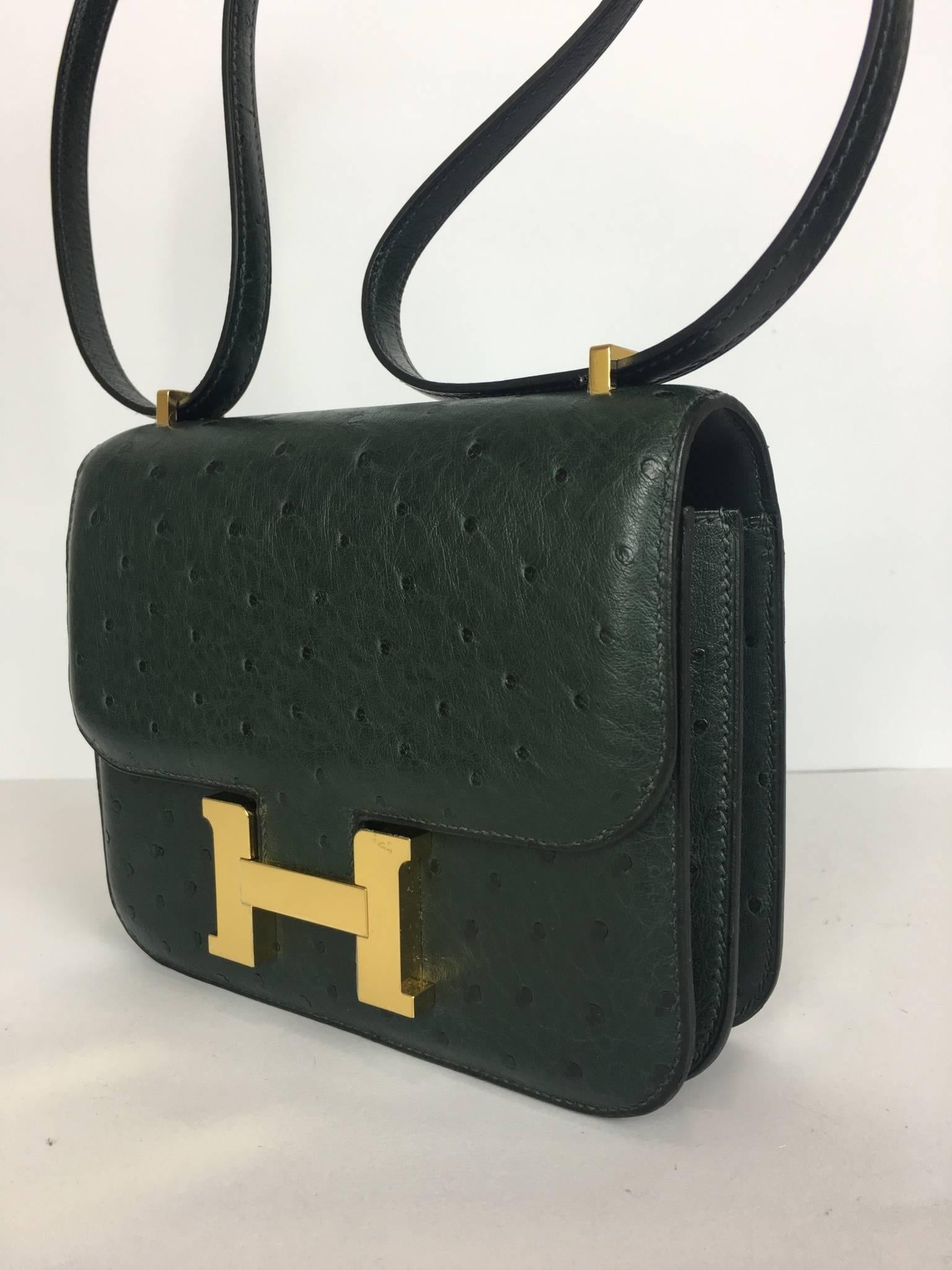 New never worn Hermes Bag
Constance
Mini
Leather Ostrich
Color Vert Titien
Gold hardware

Comes full set: 
Original box
Invoice
Raincoat
Padlock & Keys
Dustbag