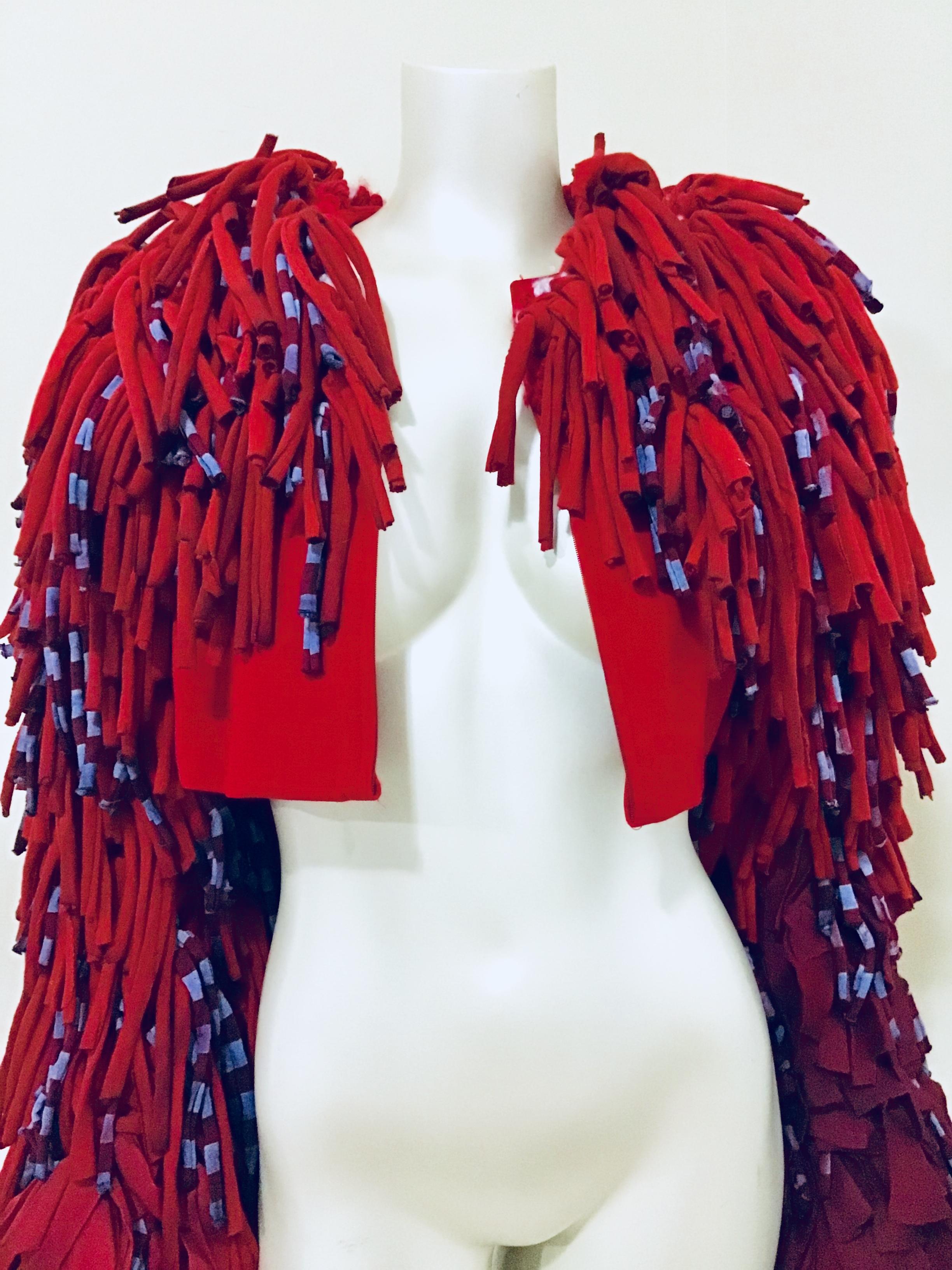 This one of a kind Born Again Vintage avant-garde piece is created from recycled T-shirts. Creating a fun and bold look that can be worn as a statement piece at any fashion event. The body is a vintage Dana Buchman jacket so has comfort and style