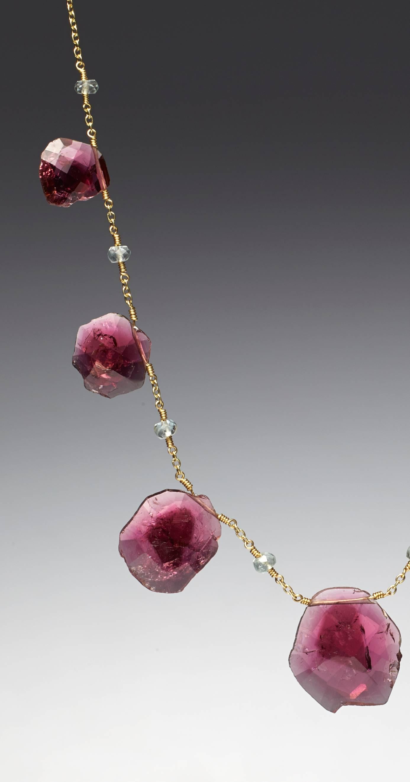 Pink tourmaline slice necklace, accented with 3.5 x 4 mm aquamarine beads. One of a kind made in 18k gold. 44.40 carats pink tourmaline. Length of necklaces 23 inches