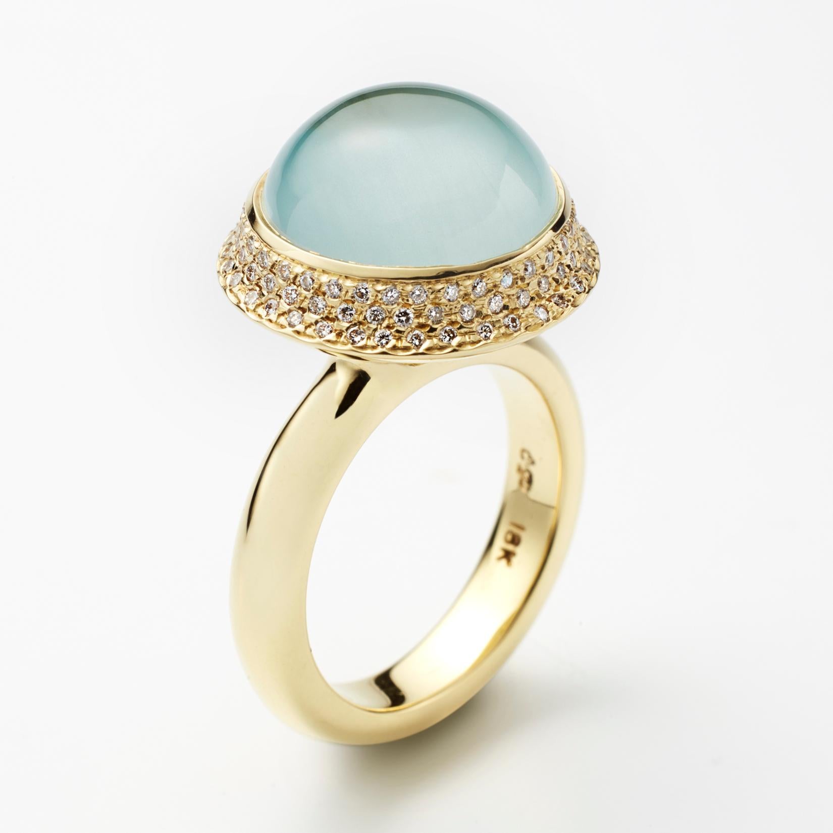 One of a kind large aquamarine cabochon 18K gold ring surrounded with inset pave diamonds, by Christopher Phelan. Ring size 6 1/2, can be sized up to 7 1/2. Top dimensions 18mm. Band width 4.25 mm.
