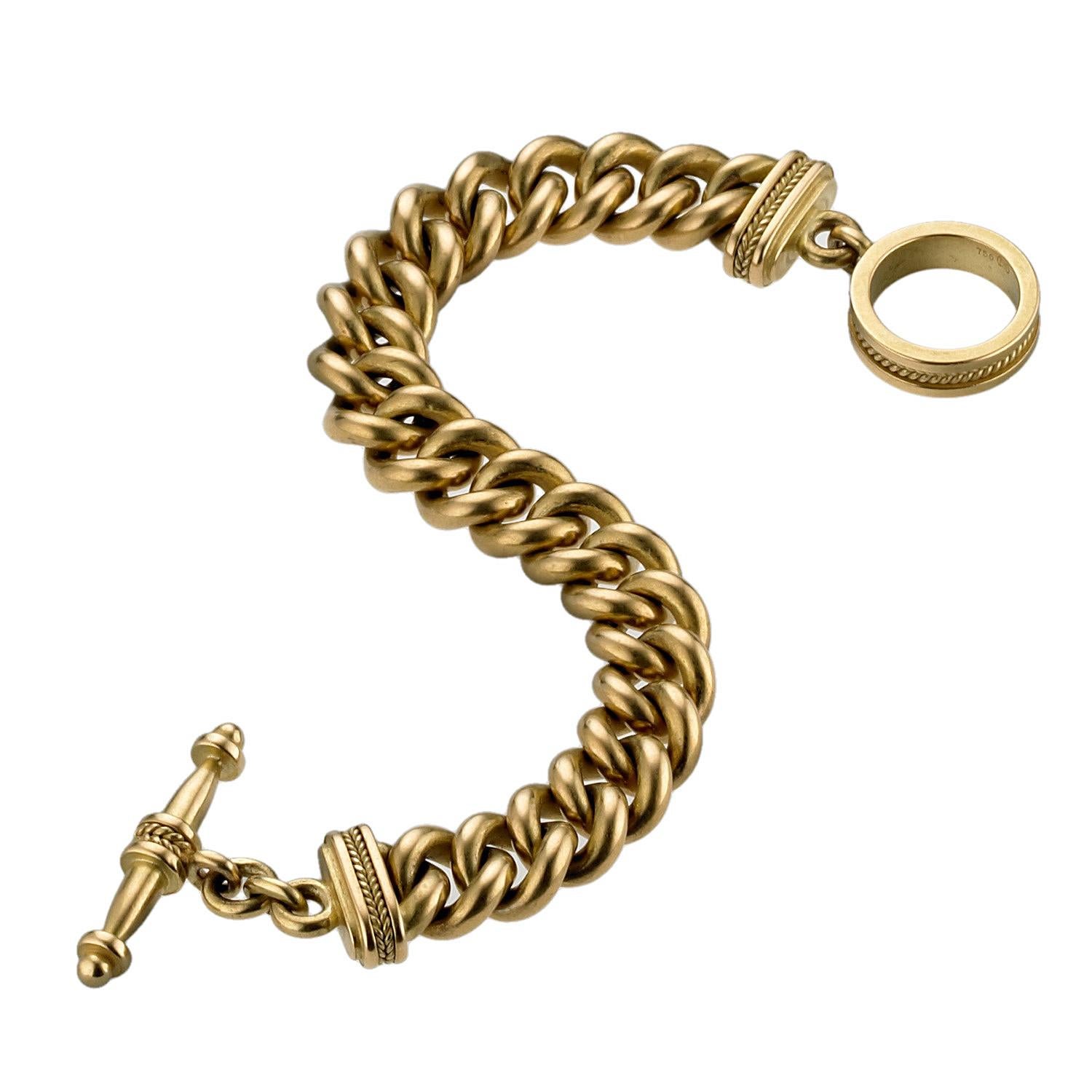 A heavy and silky smooth solid gold chain link bracelet. The toggle is embellished with finely wrought twisted gold wire. The bracelet is truly a classic, impressive, durable piece that can be worn daily. Custom made to order. Please allow 8 weeks